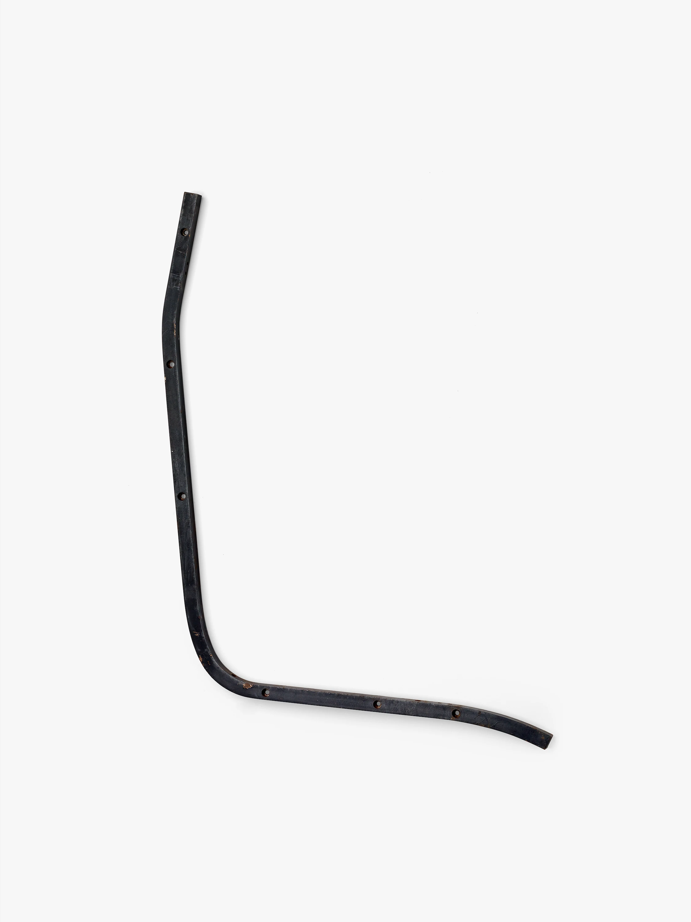 Eames Aluminum Group side rail prototype for the reclining chair is made of steel that is almost L-shaped with rounded curves.