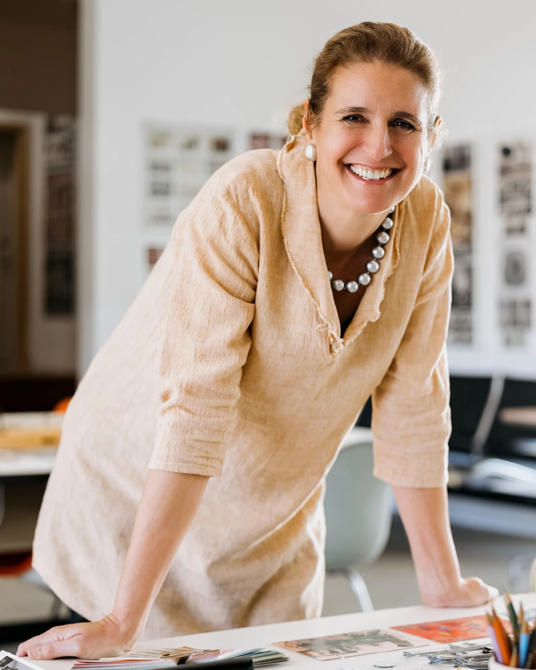The Eames Institute's Chief Curator, Llisa Demetrios (granddaughter of the Eameses), at a worktable at the Eames Ranch.