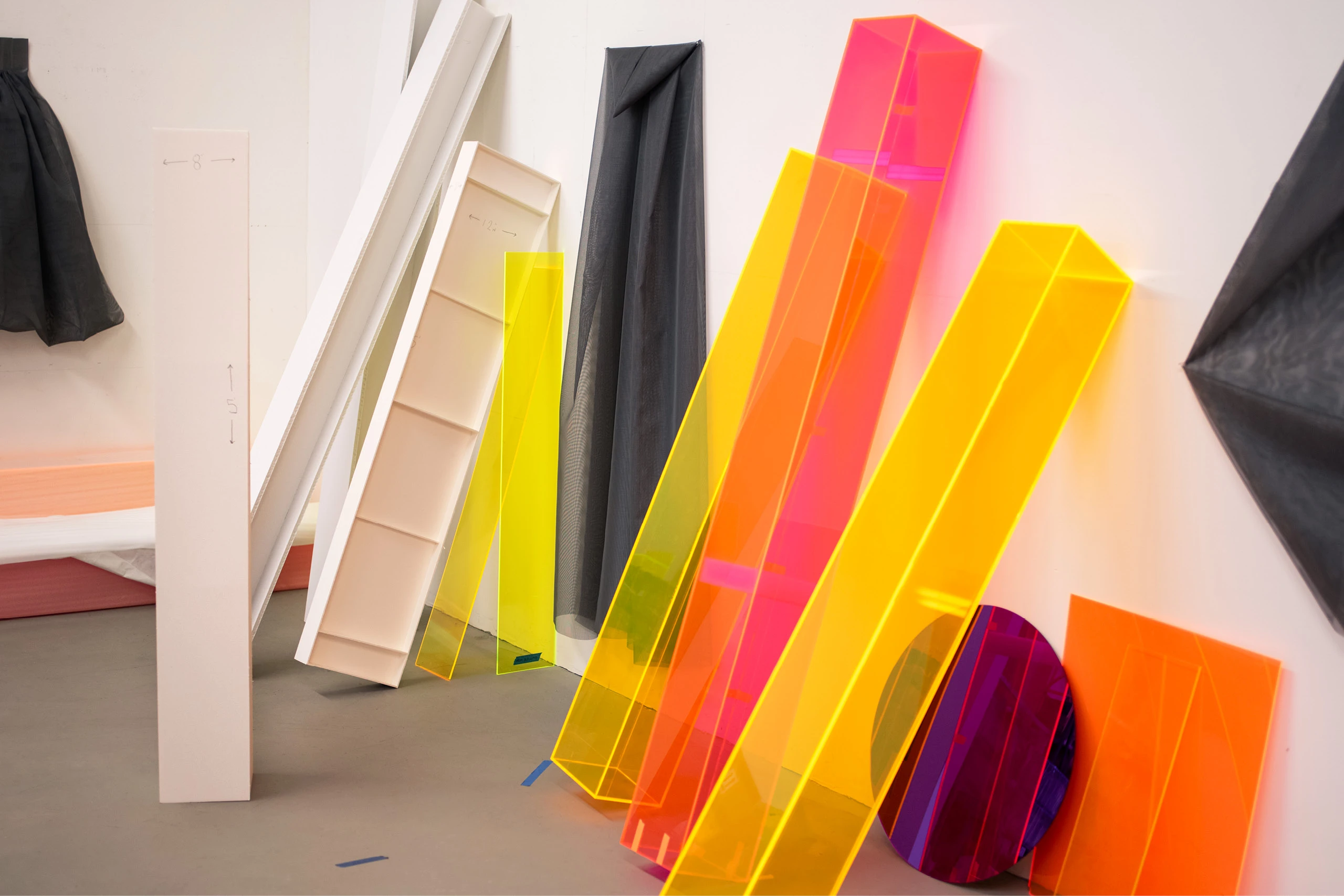 Close up of acrylic prototypes for Parallels by artist Barbara Kasten.