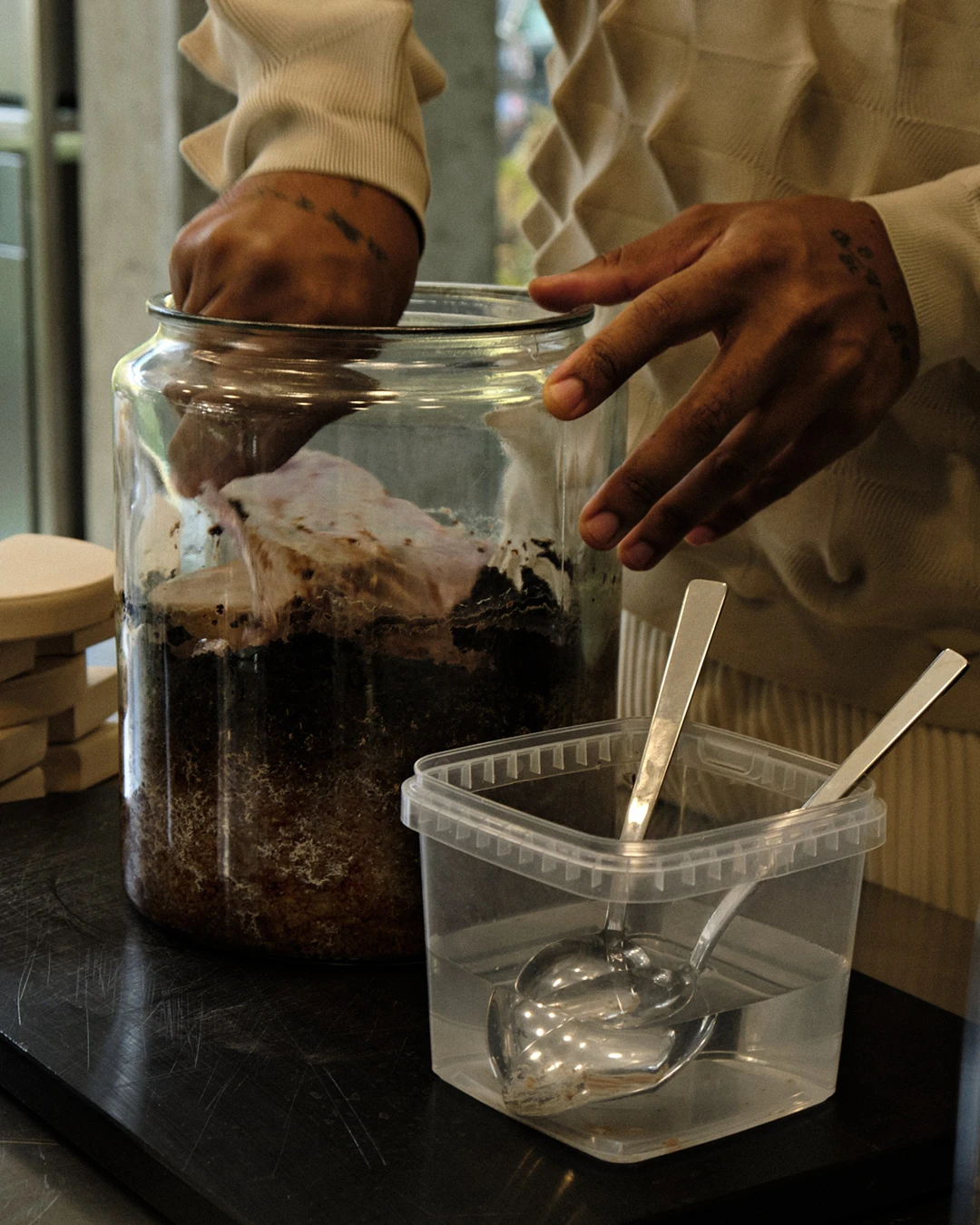 Close up of food scientist, fermenter, and recipe developer David Zilber working on recipes and fermentation techniques.
