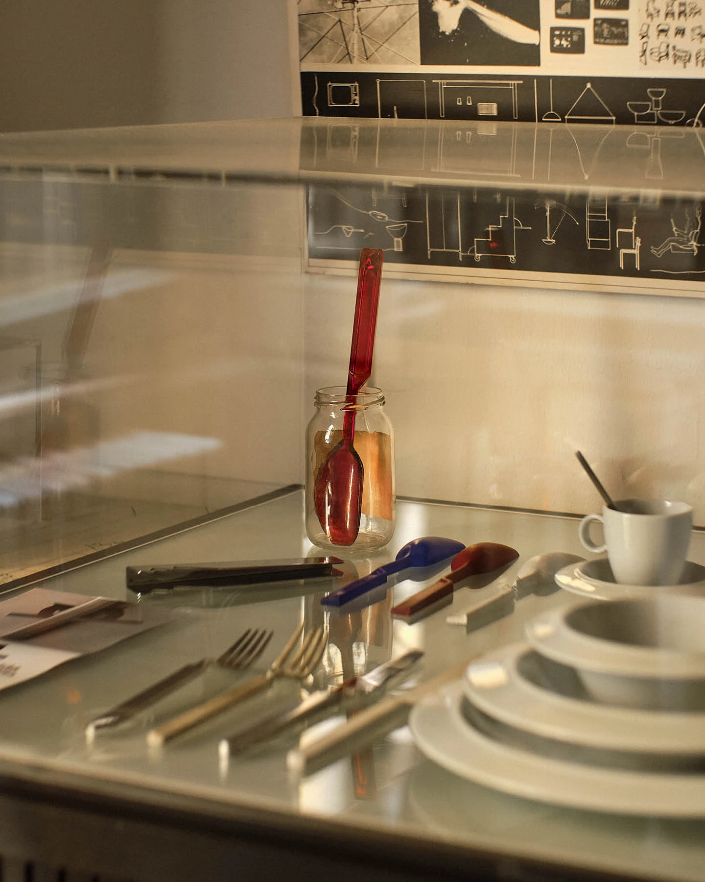 A corner view of Achille Castiglioni’s Milan studio with examples of his designs for flatware and ceramics.