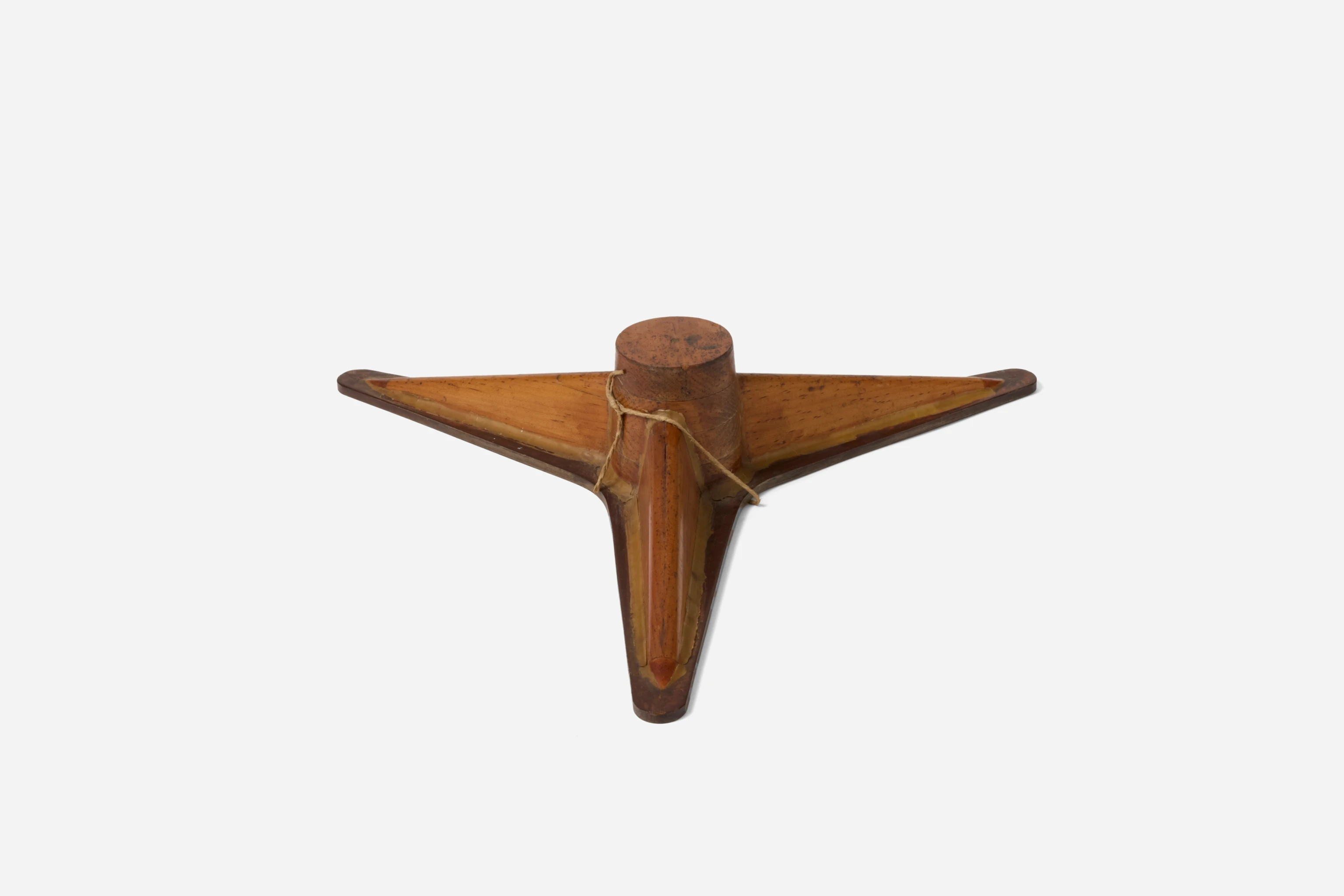 Angled front view of the Eames wooden mold prototype of the thre point Lounge Chair spider or base.