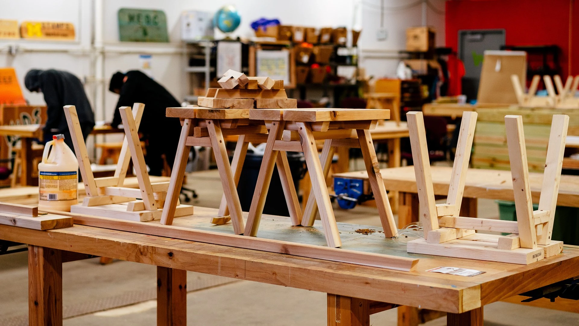 At Brightmoor Maker Space workshop, handmade wooden Ishinomaki benches sit on top of a work table, Kazam! Magazine.