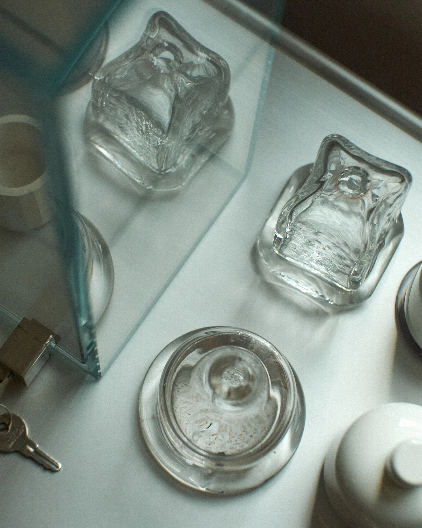 Several glass samples for a perfume bottle on a tray by design studio Formatantasma.