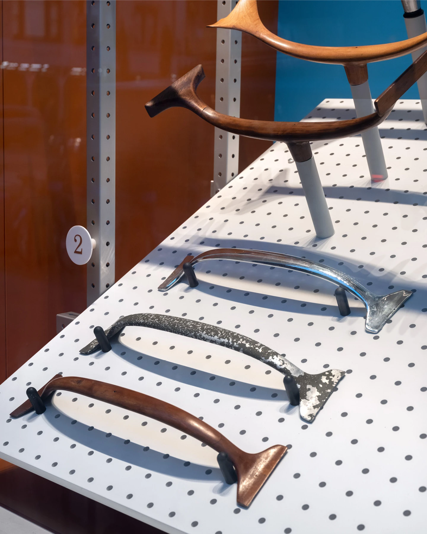 Display at Herman Miller includes Eames Aluminum Group Chair wood and aluminum prototype components.