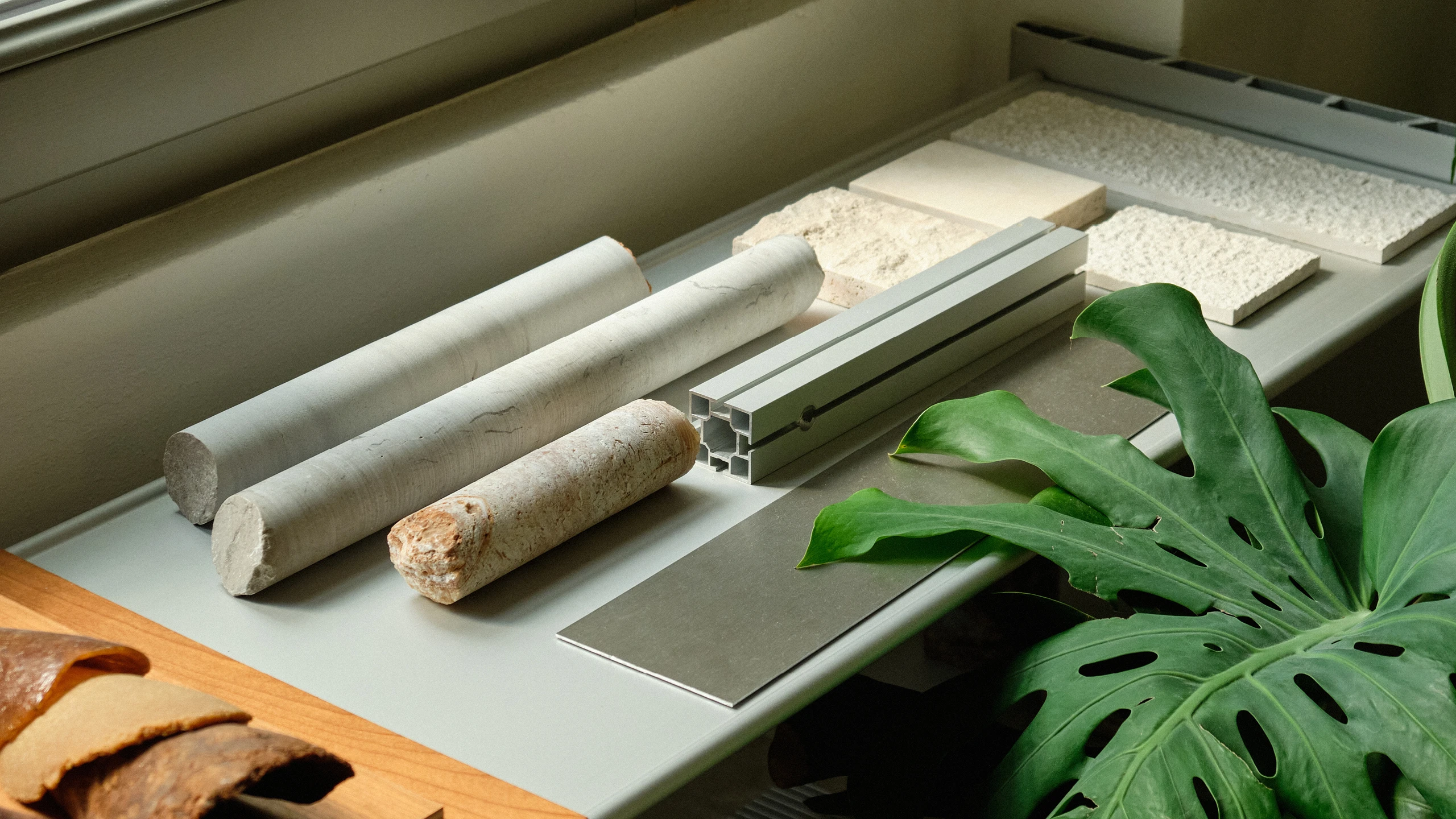 Samples of materials derived from natural sources on a table that were used in collections designed by Formafantasma.