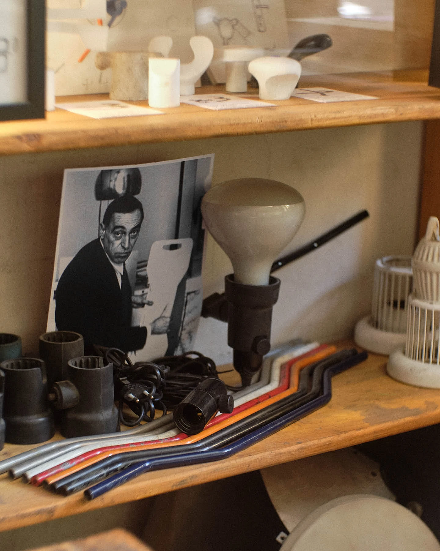 Shelves from Achille Castiglioni’s Milan studio filled with prototypes and sketches that reflect his design process.
