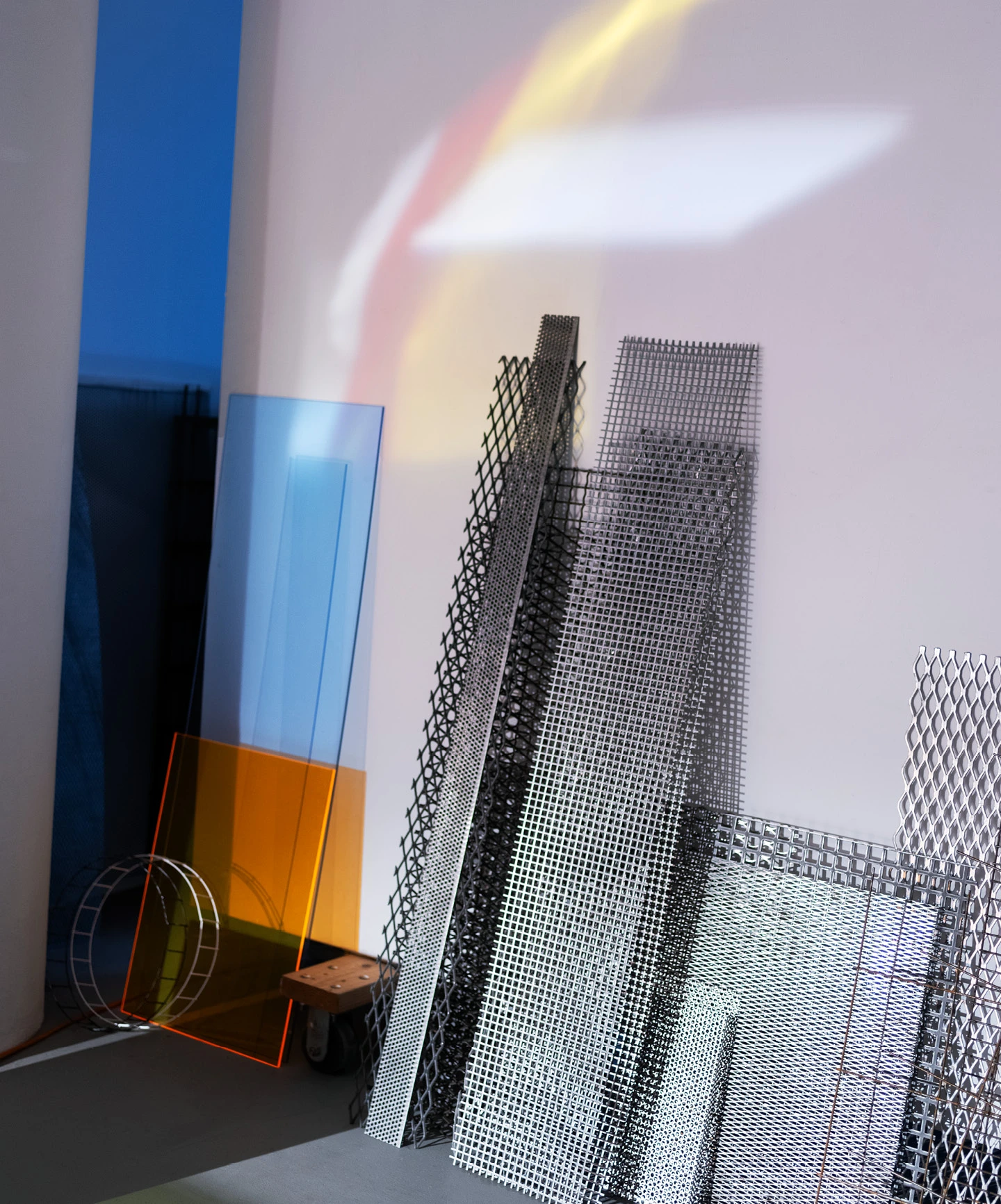 Artist Barbara Kasten’s Chicago studio with several acrylic and steel sheets leaning against the wall.