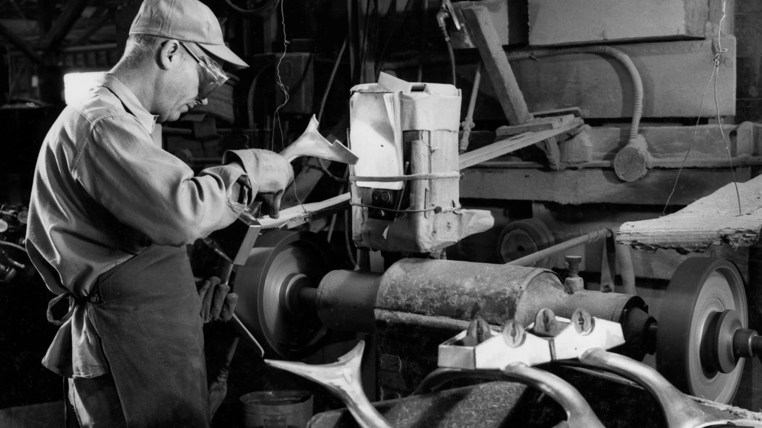 The edges from the Eames Aluminum Group antler casting are sanded down and the aluminum is polished. Image courtesy of Herman Miller Archives.