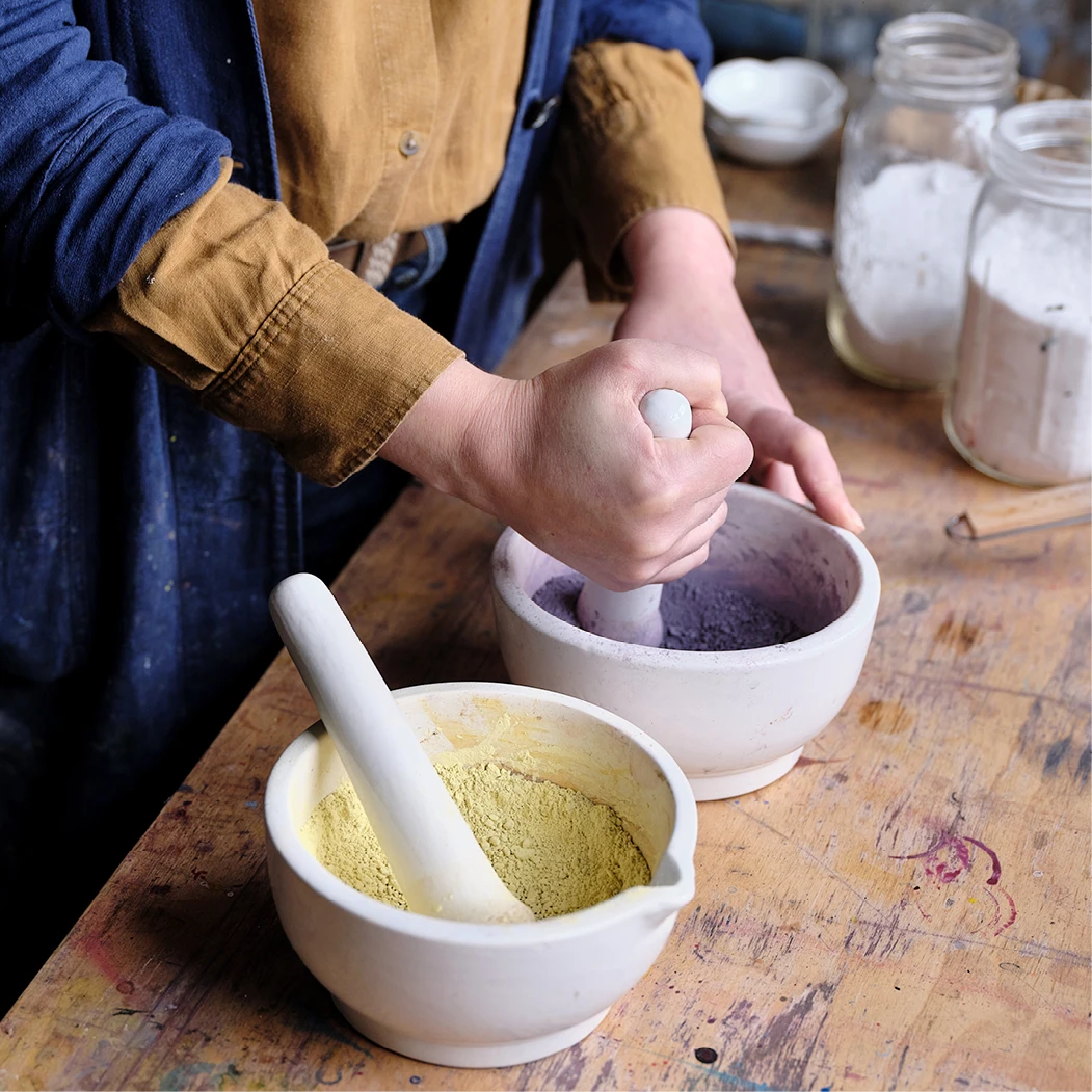 After precipitating the pigment, abstract artist Natalie Stopka washes it to remove impurities, then dries and grinds it; shown here are dried weld and logwood lake pigments.