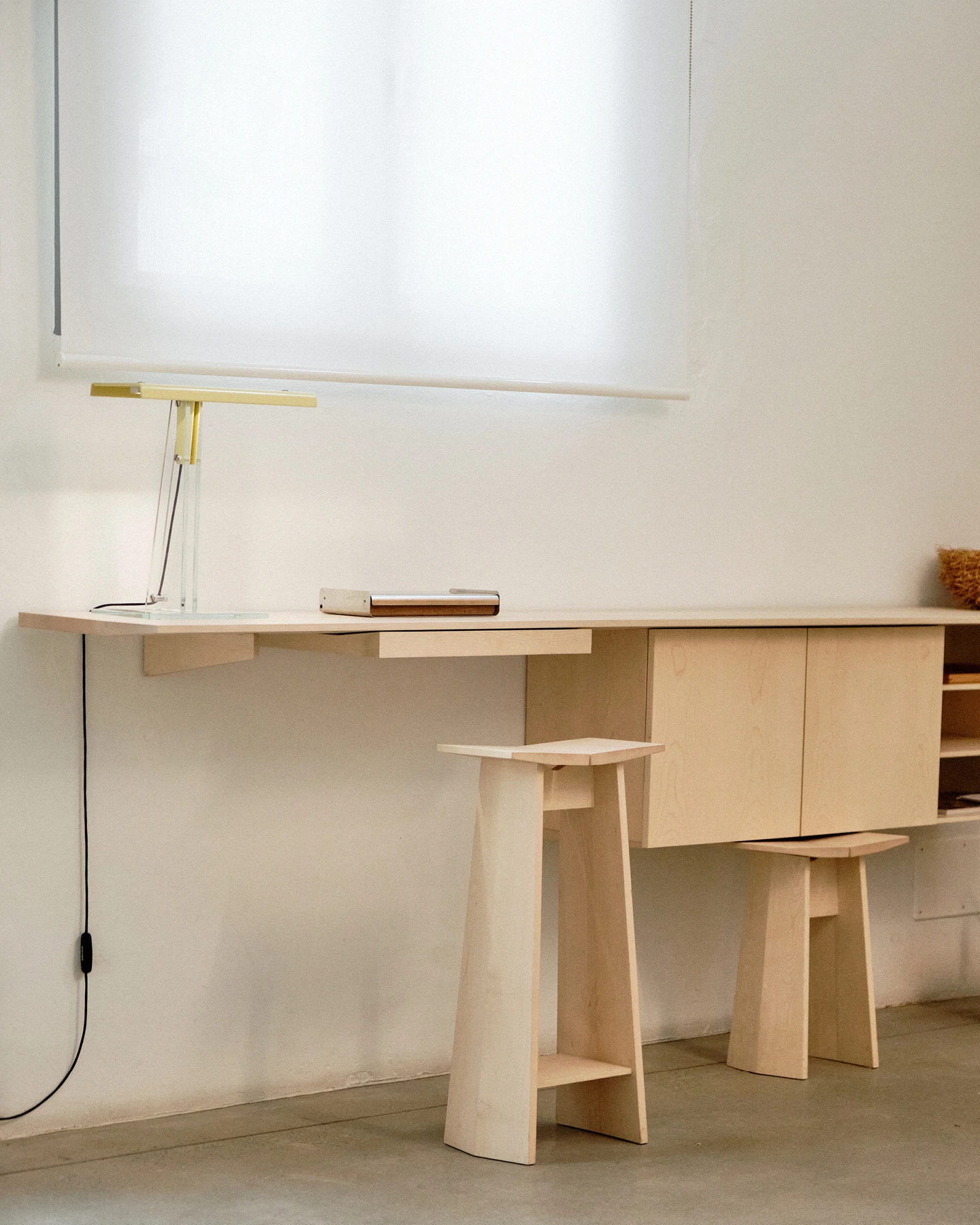Assab console and tall stool in light colored wood designed by Formafantasma.