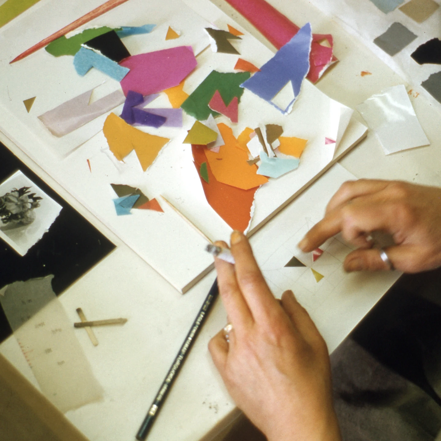 Ray Eames’s hands working on a design reflect how abstract painting influenced her design process. Image © Eames Office, LLC