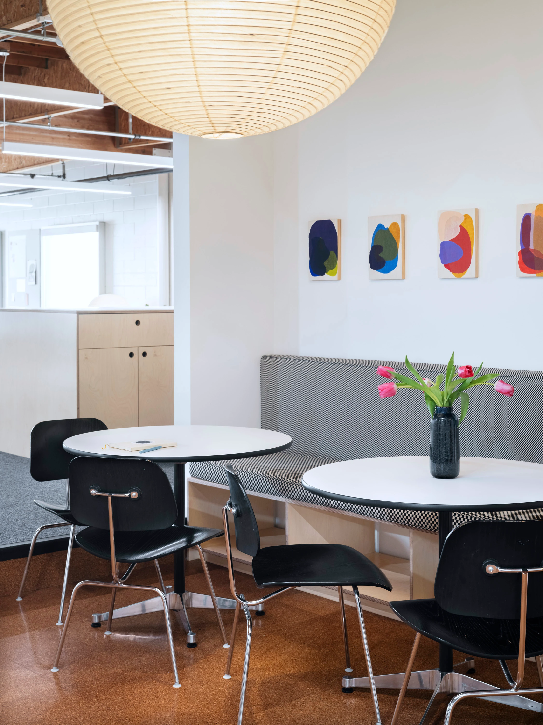 Cafe-style seating in the Eames Institute's Richmond offices.