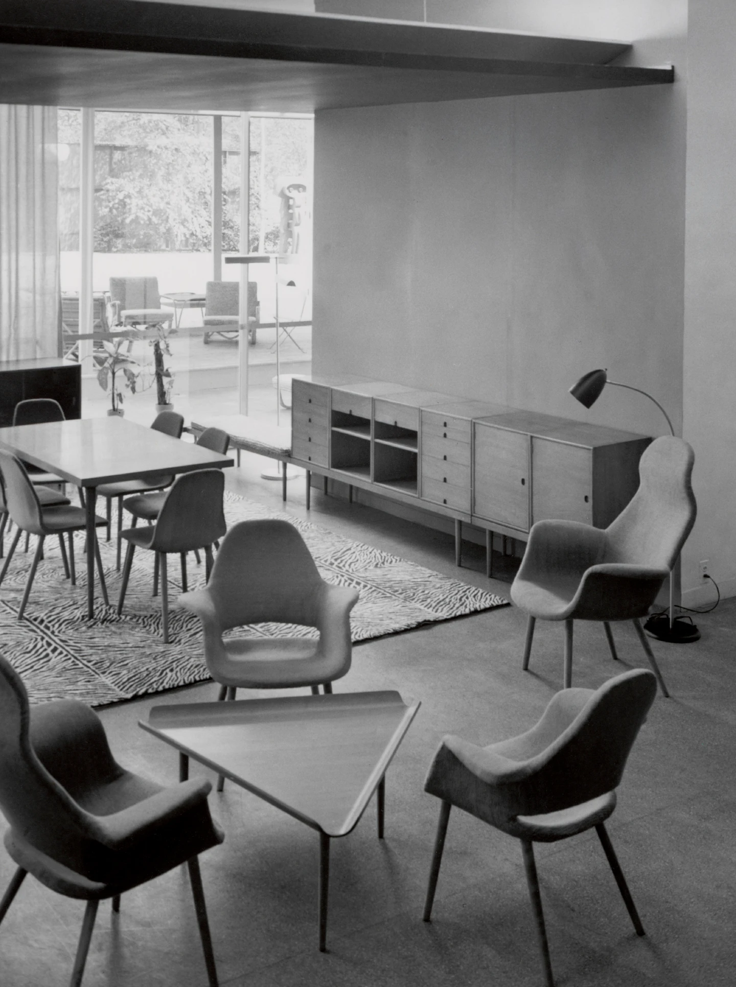 Installation view of the Organic Design in Home Furnishings exhibition showing several Saarinen-Eames furniture designs.