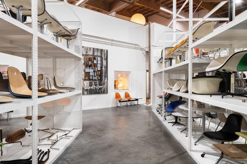 Furniture and prototypes designed by Ray and Charles Eames fill the aisles at the Eames Institute in Richmond California.