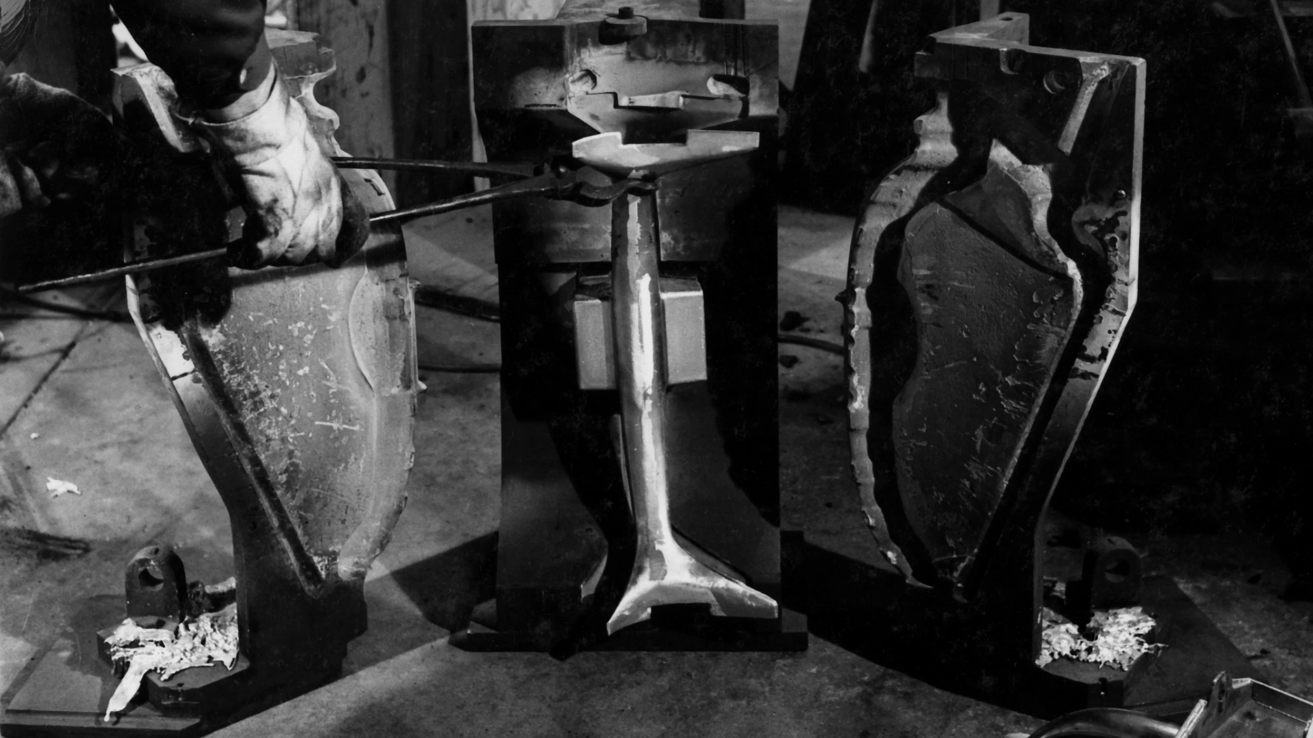 An Eames Aluminum Group cast “antler” is removed from its mold. Image courtesy of Herman Miller Archives.