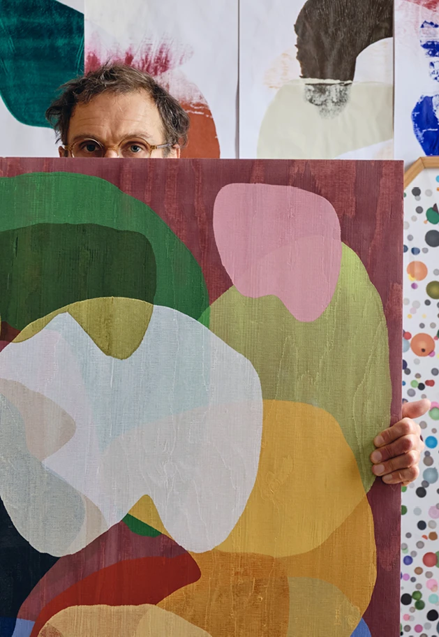 Artist Daniel Eatock with one of his colorful Rolling Pin Paintings.