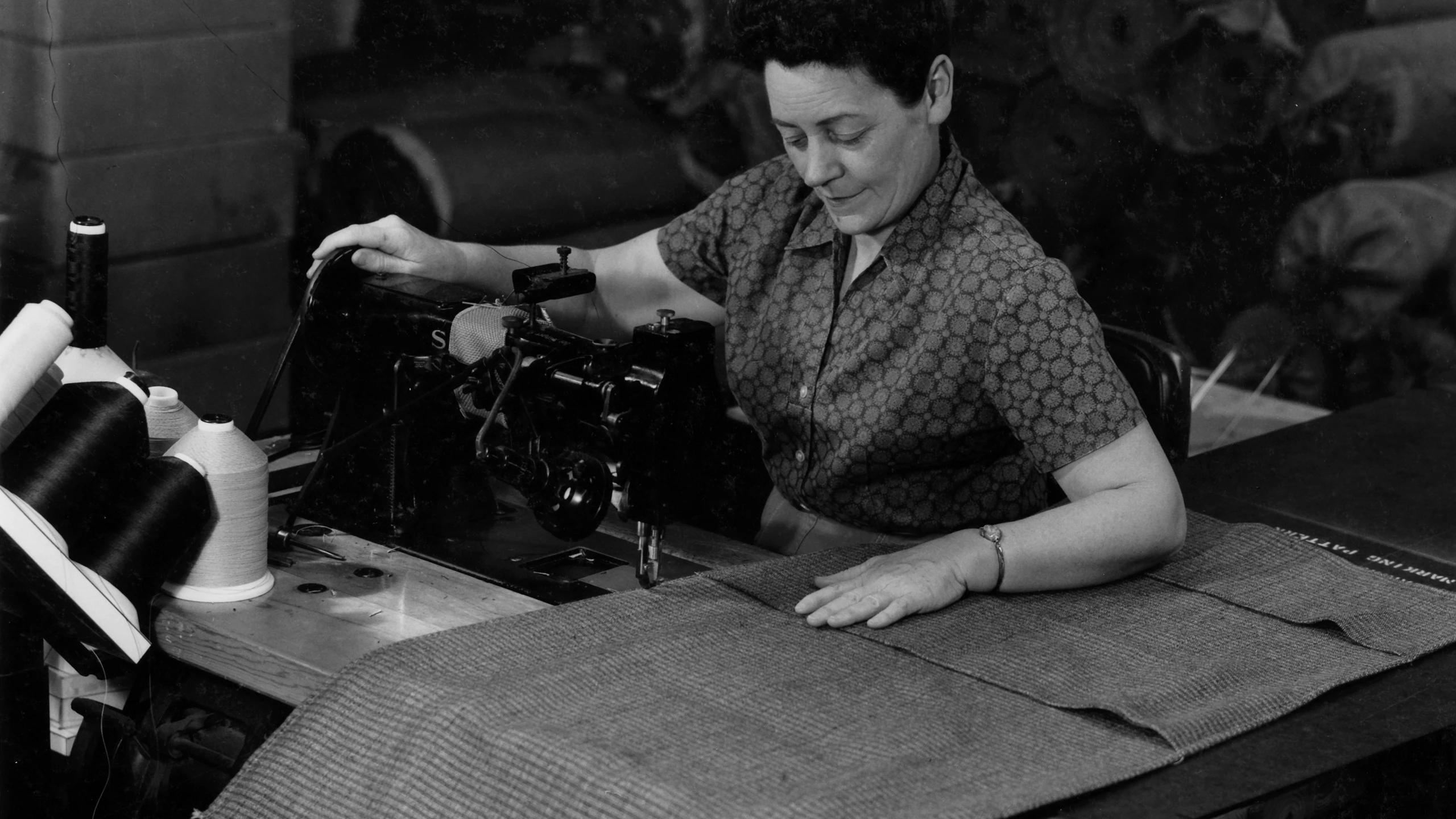 Saran textile is sewn into what will become the Eames Aluminum Group chair‘s seat. Image courtesy of Herman Miller Archives.