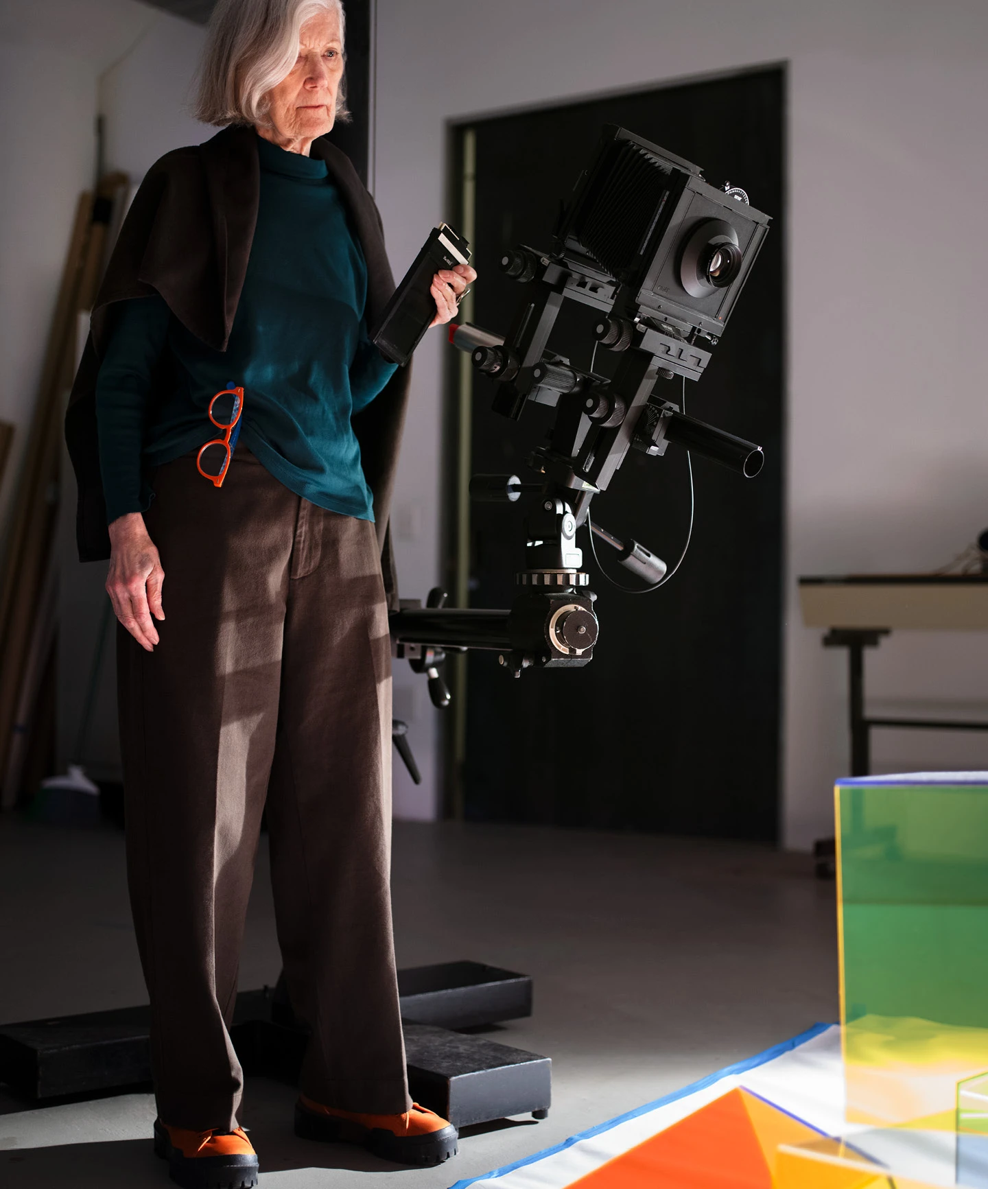 Barbara Kasten in her studio photographing an acrylic prototype.