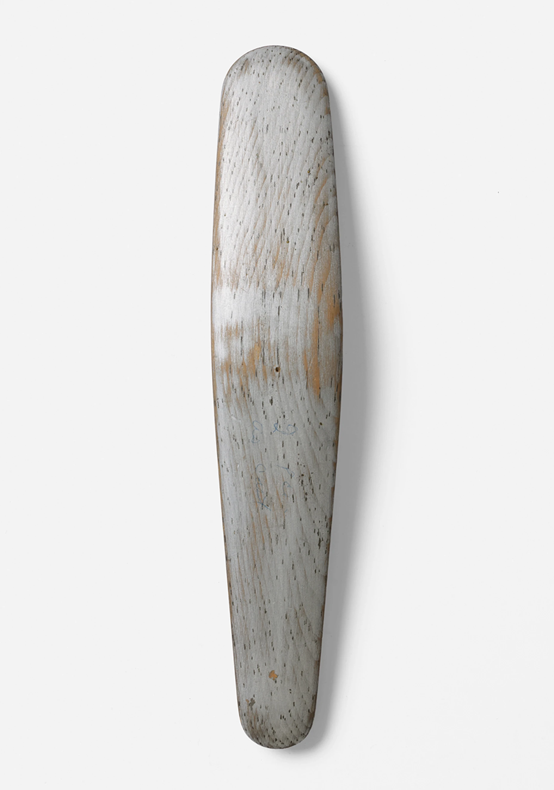 Top down view of a carved and painted wooden model for the aluminum back support of the Eames Lounge Chair.