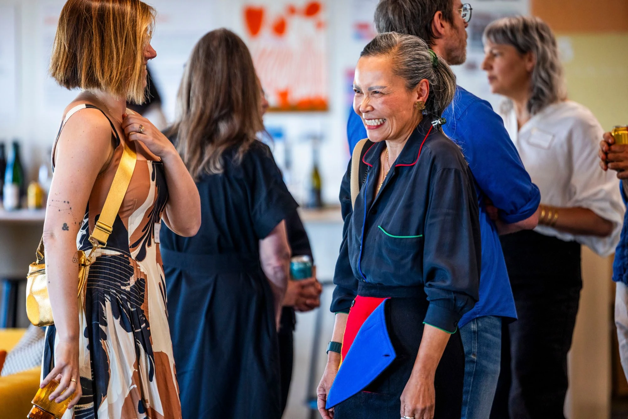 Close up view of attendees at a design event at the Eames Institute in Richmond, California.