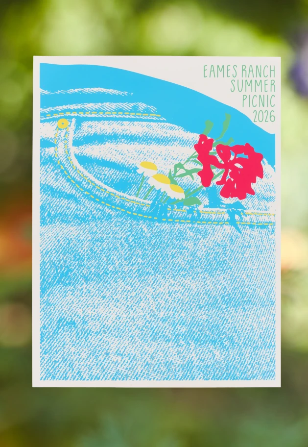 Eames Institute 2026 summer picnic poster design by Chloe Looker, featuring a close up of a pair of jeans with flowers in the background.