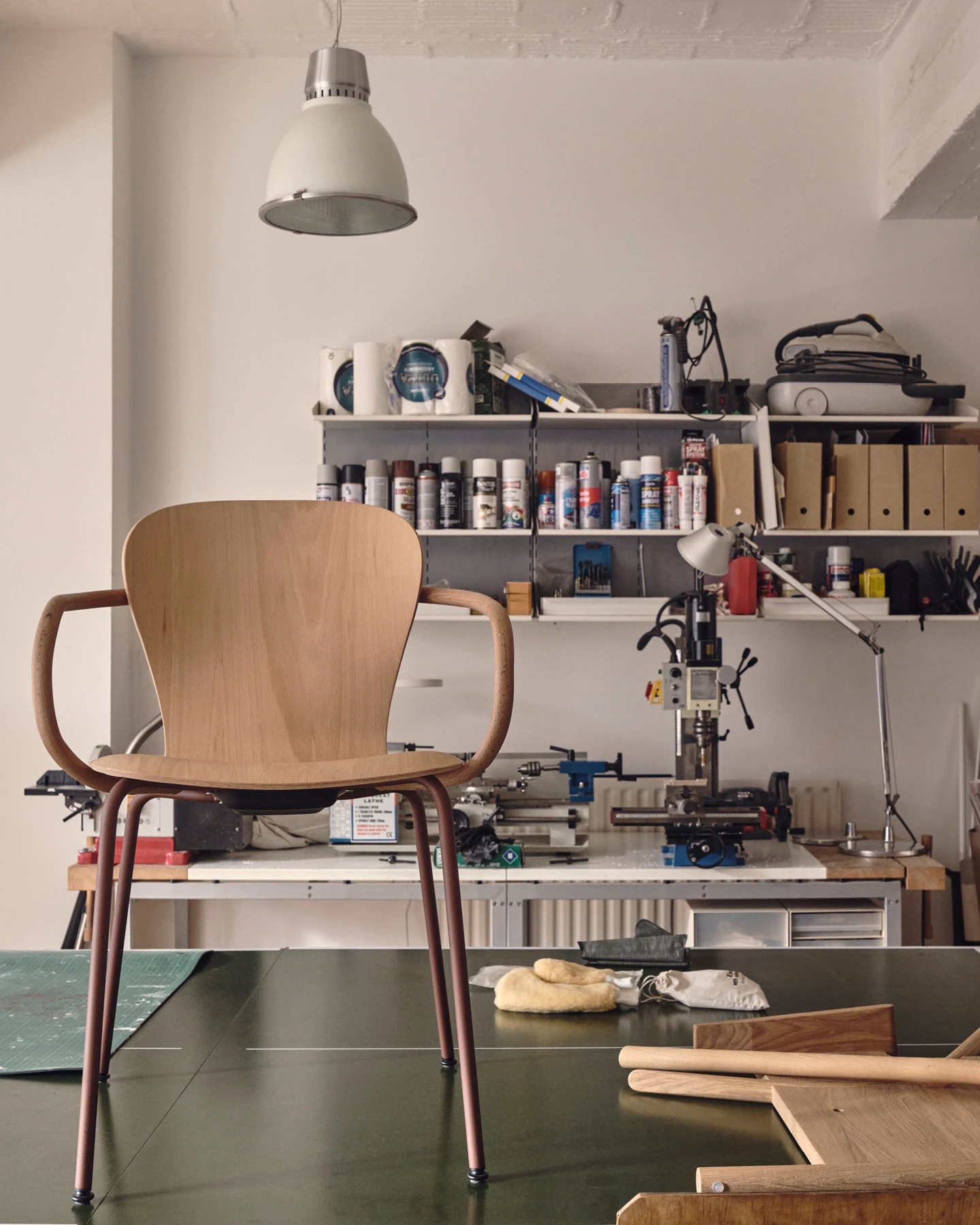Interior of the London design studio Industrial Facility showcasing a modernist wooden chair—Kazam! Magazine.