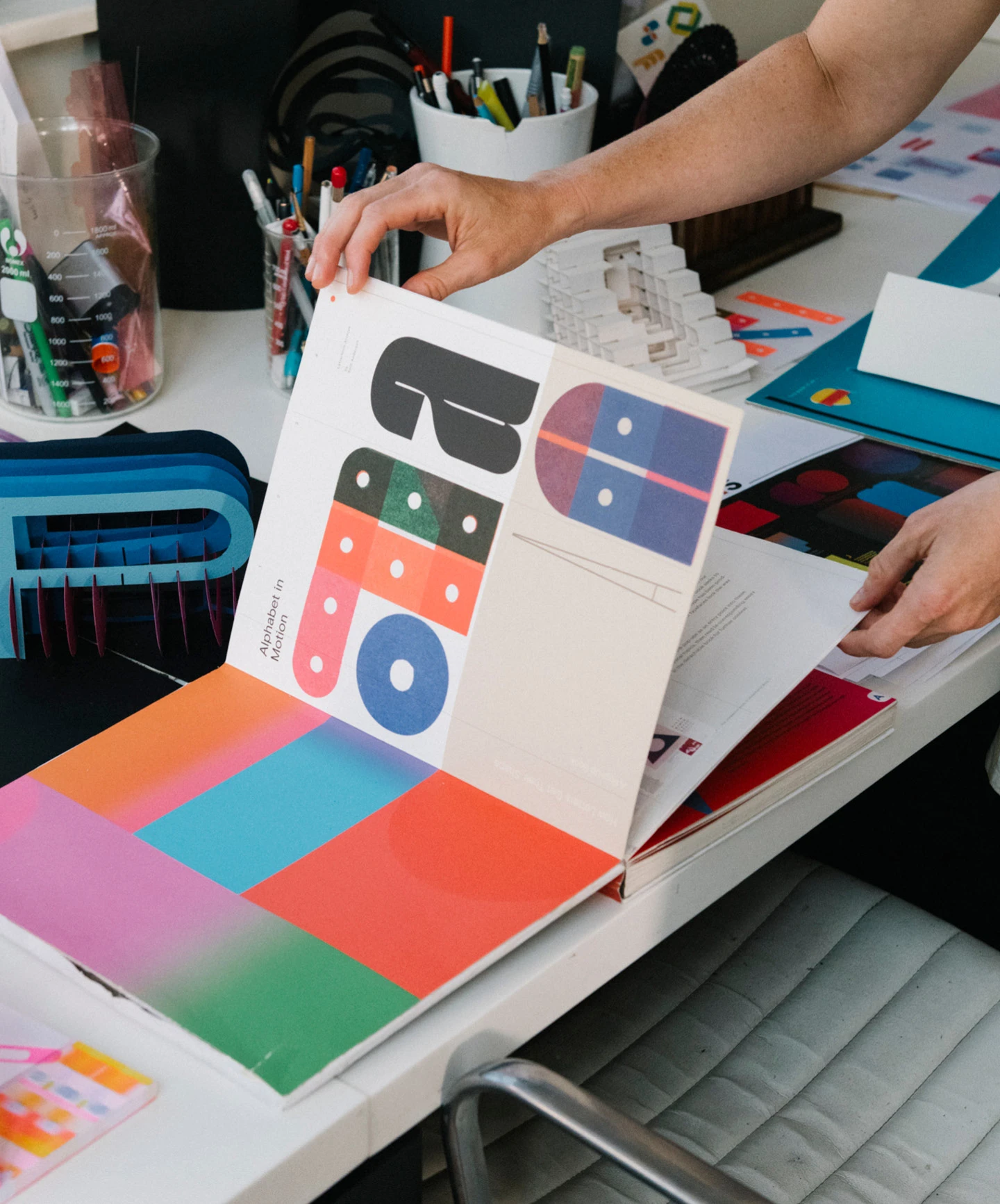 Interior of the "Alphabet in Motion” pop-up book by designer and paper engineer Kelli Anderson.