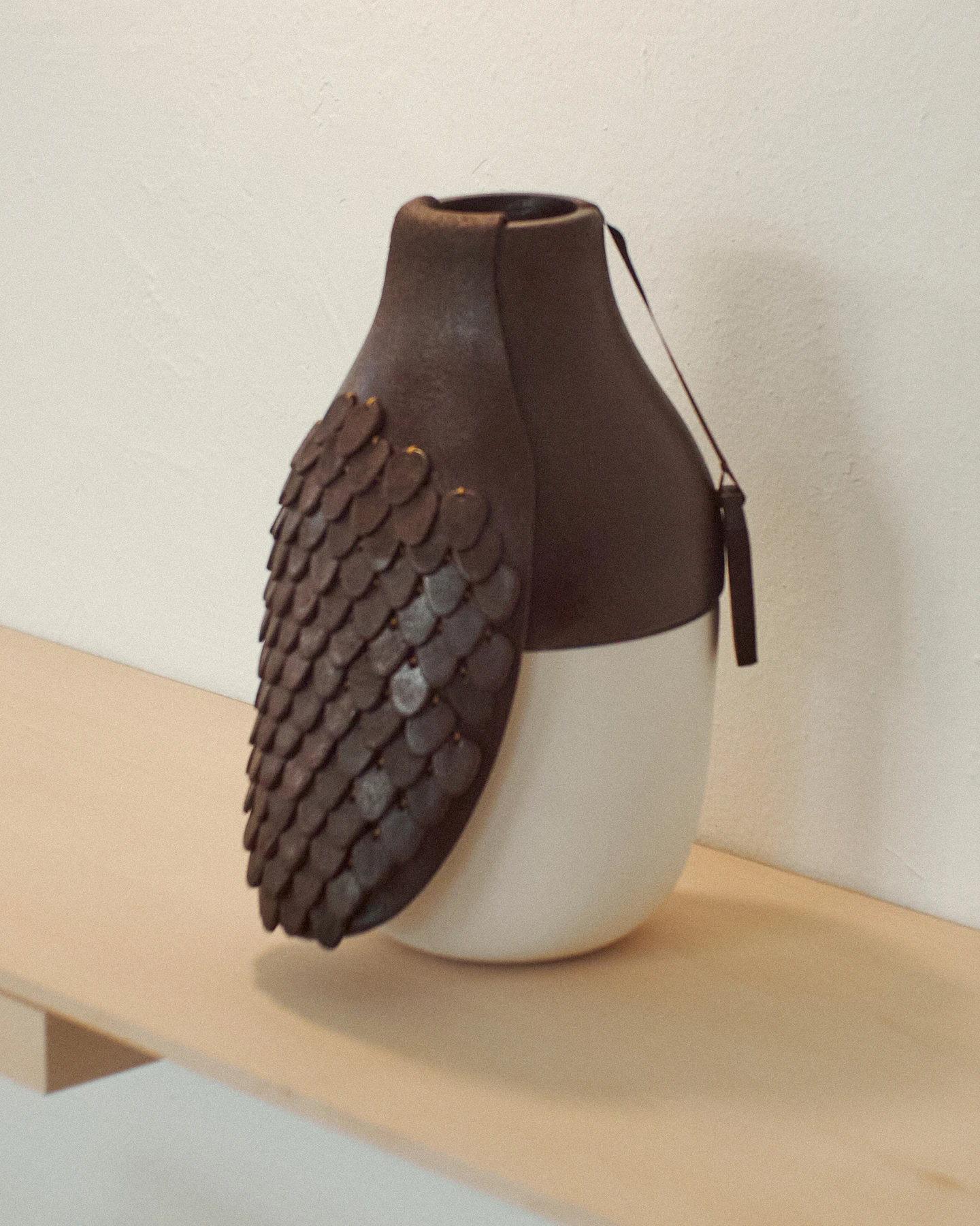 Unglazed ceramic vessel designed by Formafantasma, made with natural shellac and wood fibers.