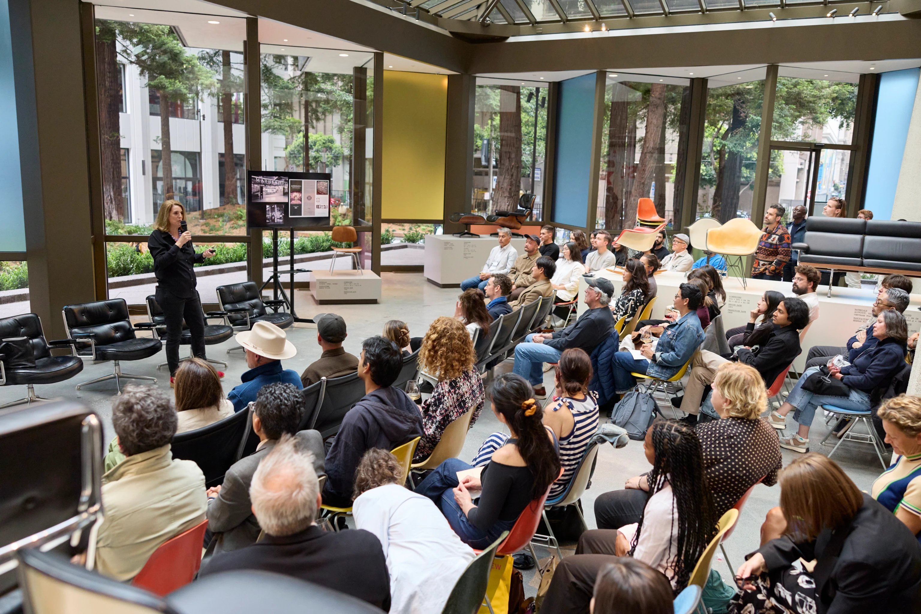 Llisa Demetrios from the Eames Institute giving a talk in the gallery at the Transamerica Pyramid