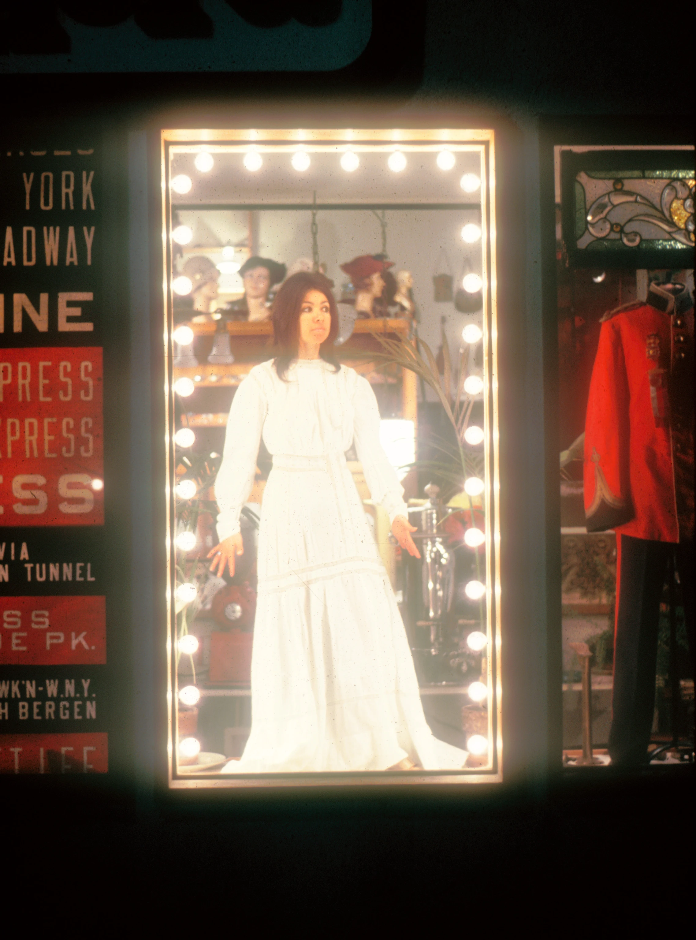 Annette Del Zoppo standing in front of a mirror at Ephemera, a vintage clothing store that she co-founded.