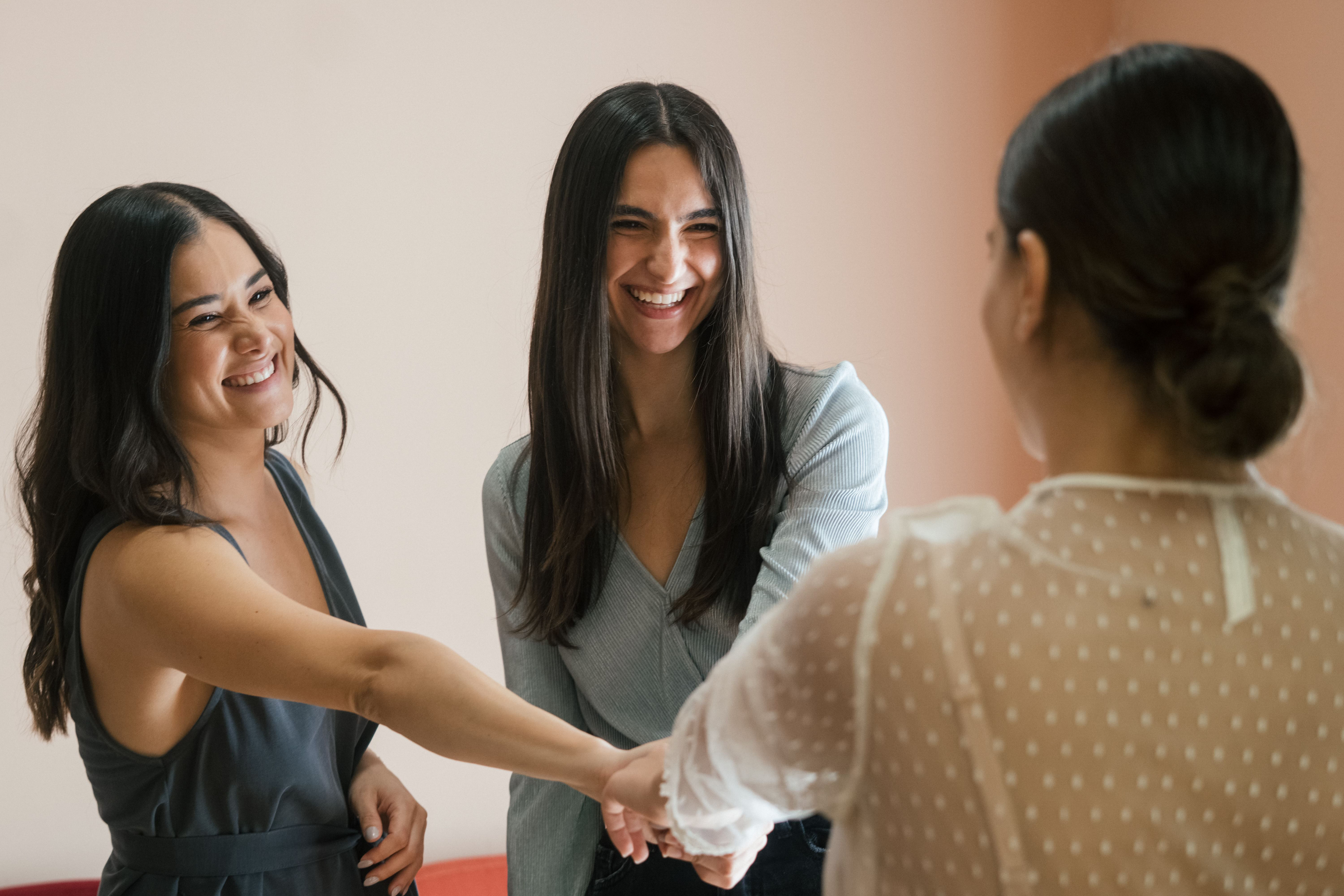 Two women talking together in a bright room
