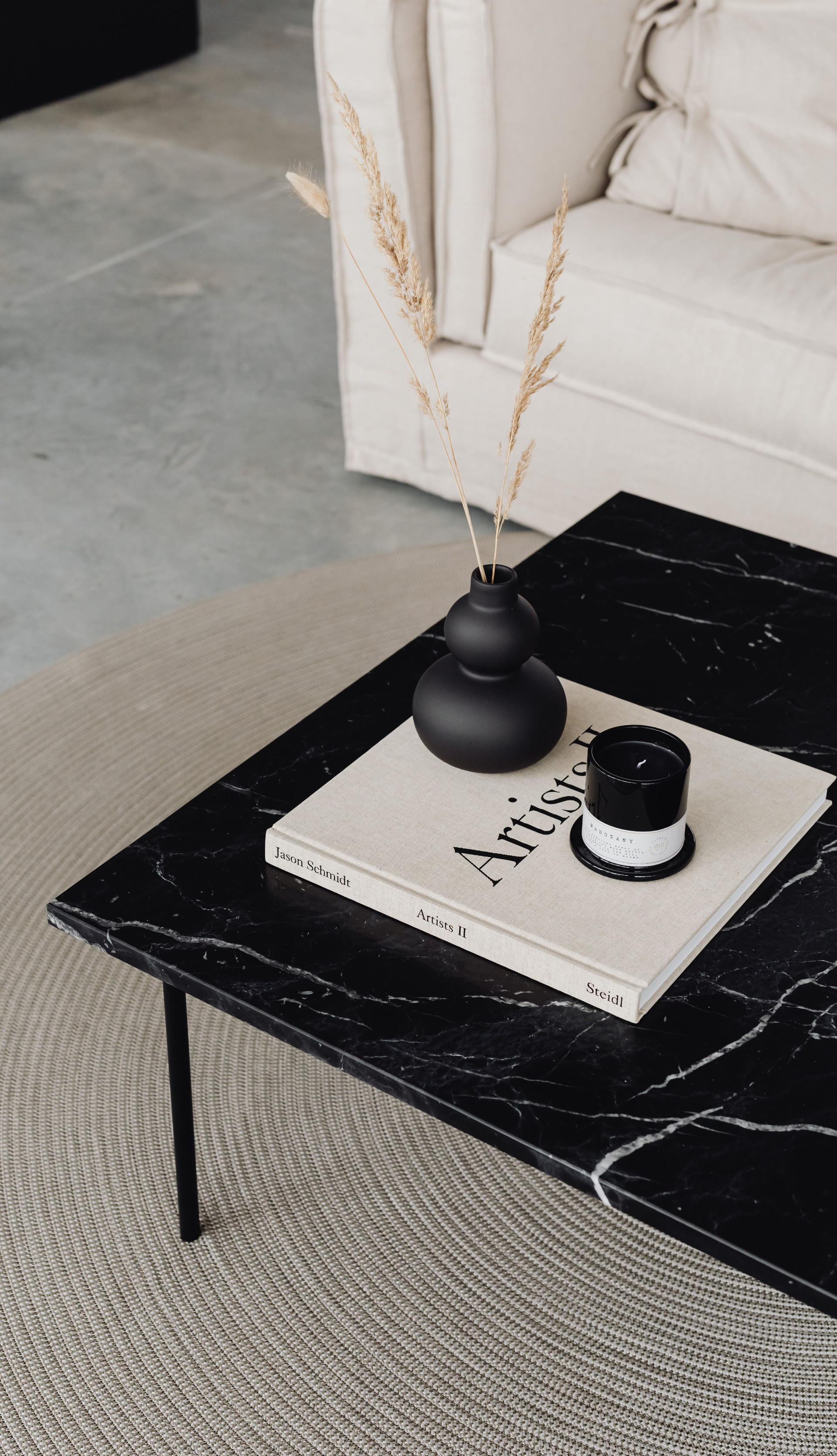 Sunlit living room with coffee table books