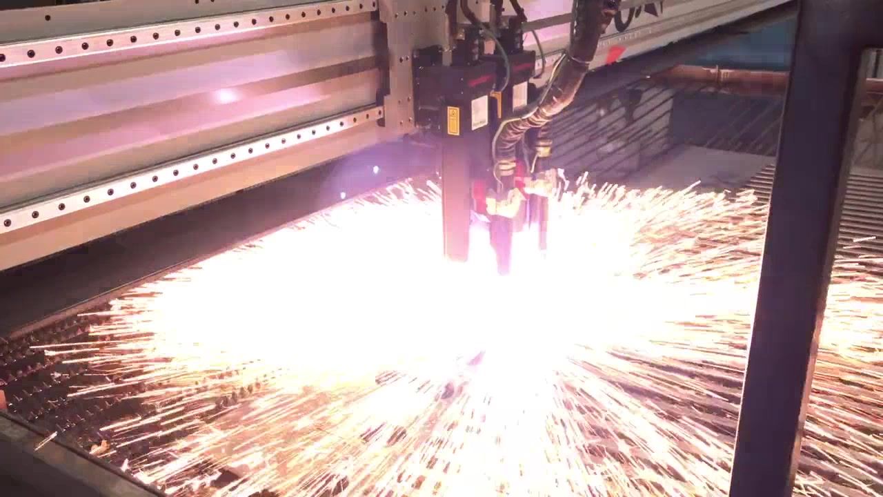 AlphaTek-built CNC plasma cutting machine operating on steel plate