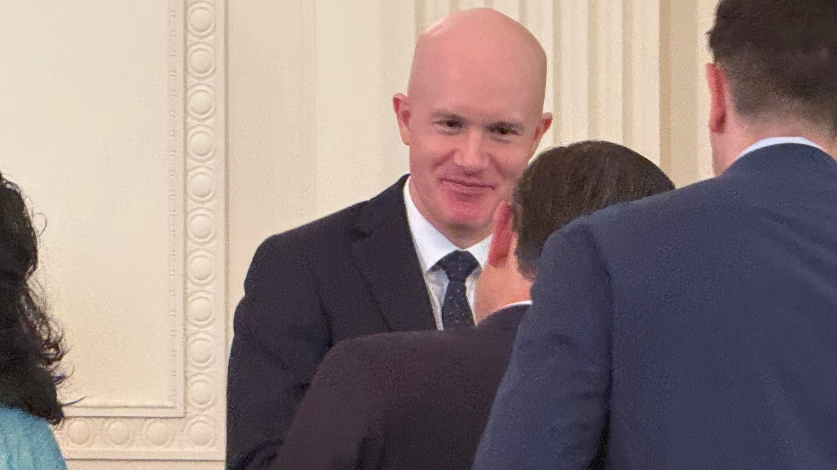 Coinbase CEO Brian Armstrong speaking to House Speaker Mike Johnson on July 18, 2025. (Jesse Hamilton/CoinDesk)
