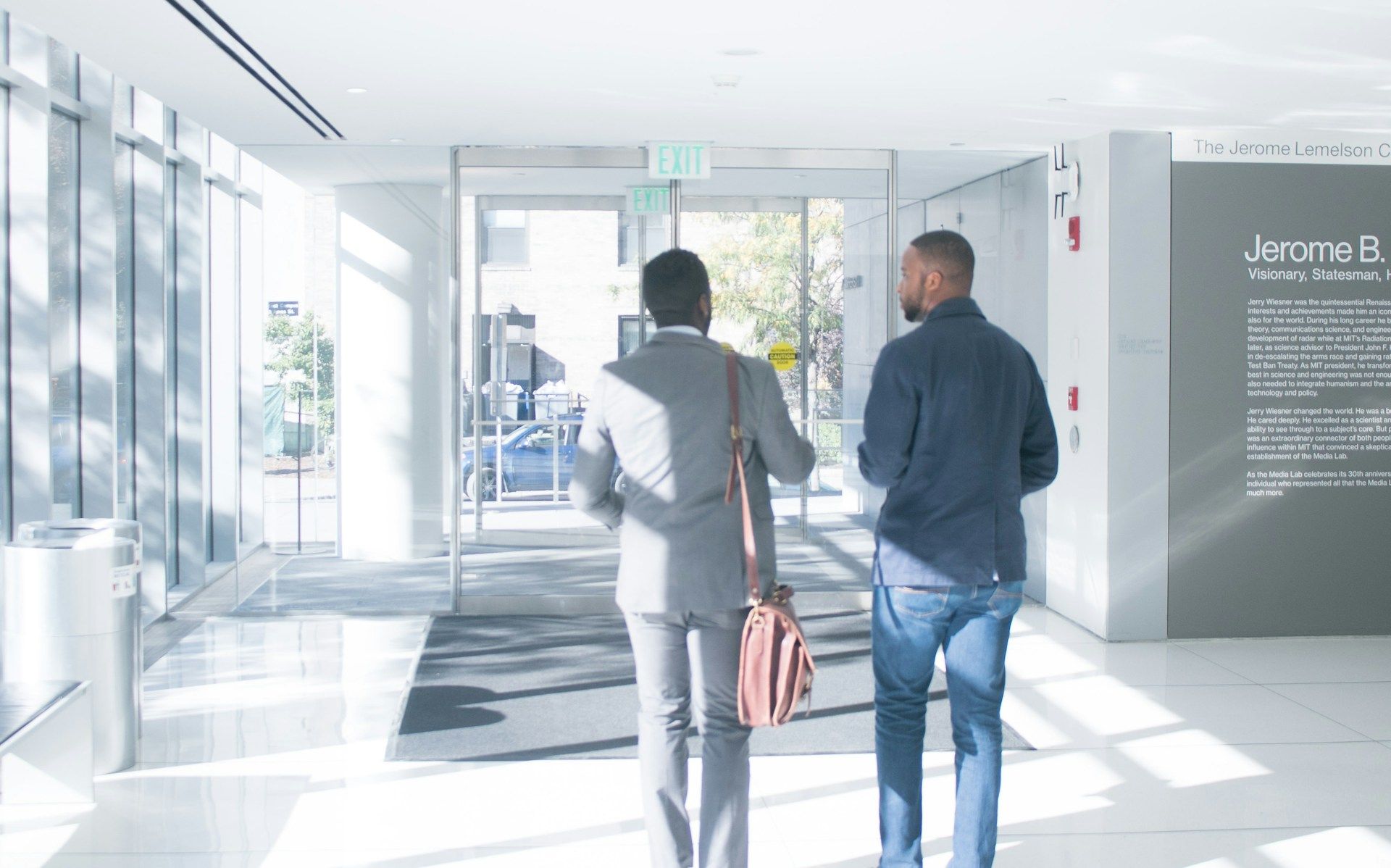 Two individuals leaving an office (The Jopwell Collection/Unsplash)