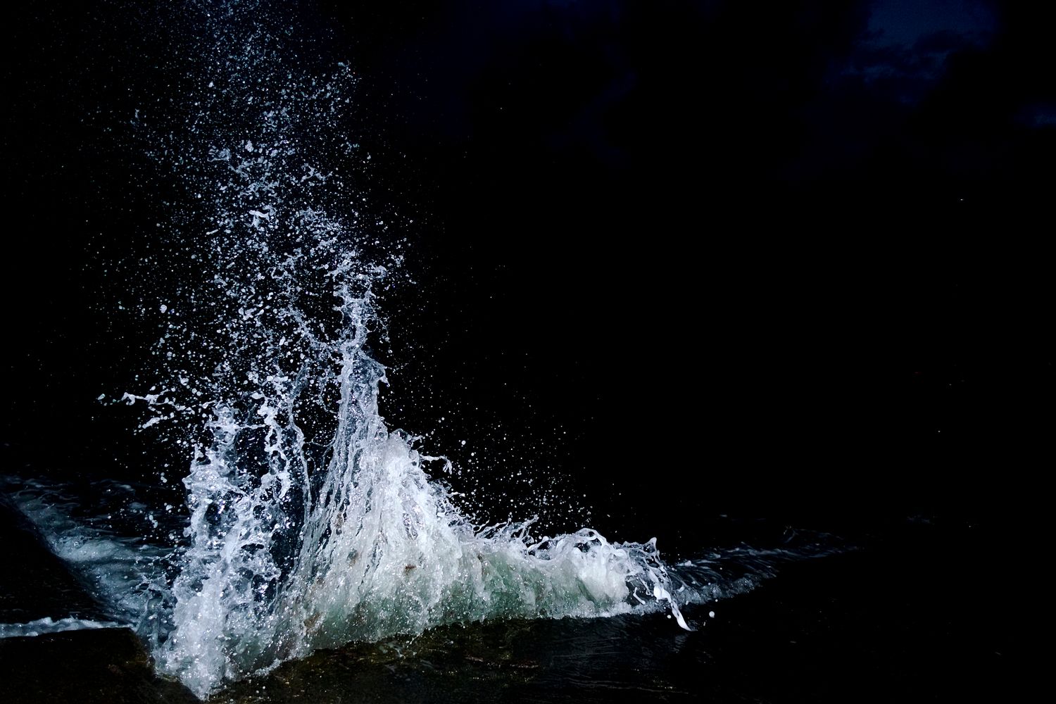 Waves at night (Shutterstock modified by CoinDesk)