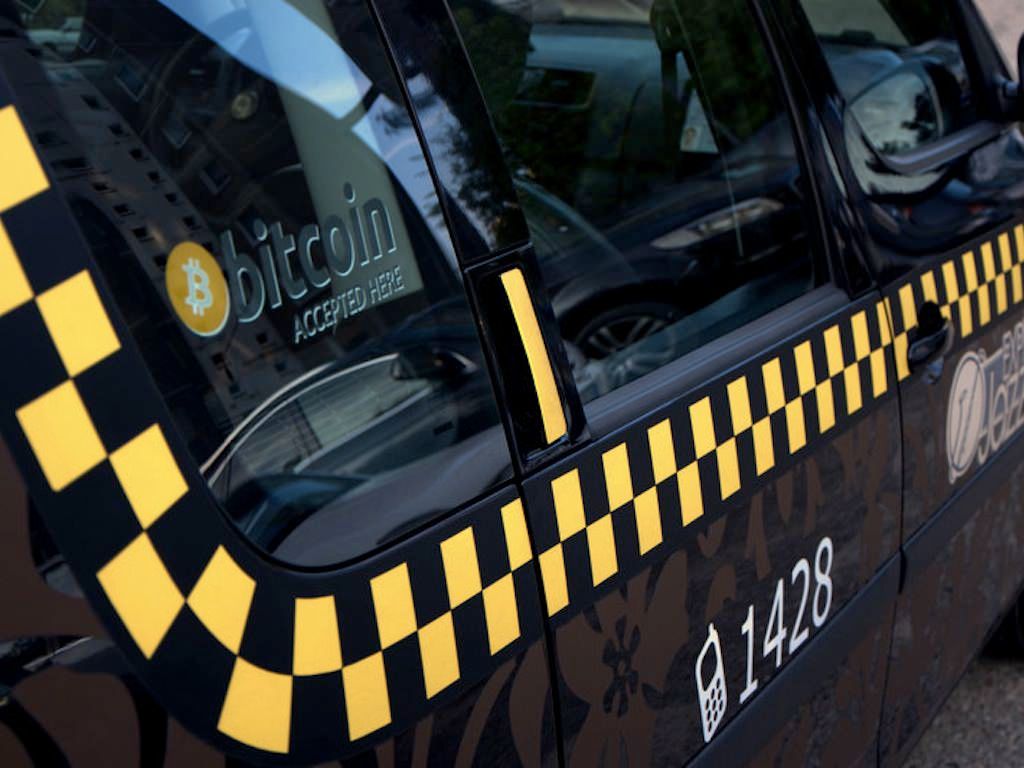 Taxi firms seek to drive bitcoin adoption