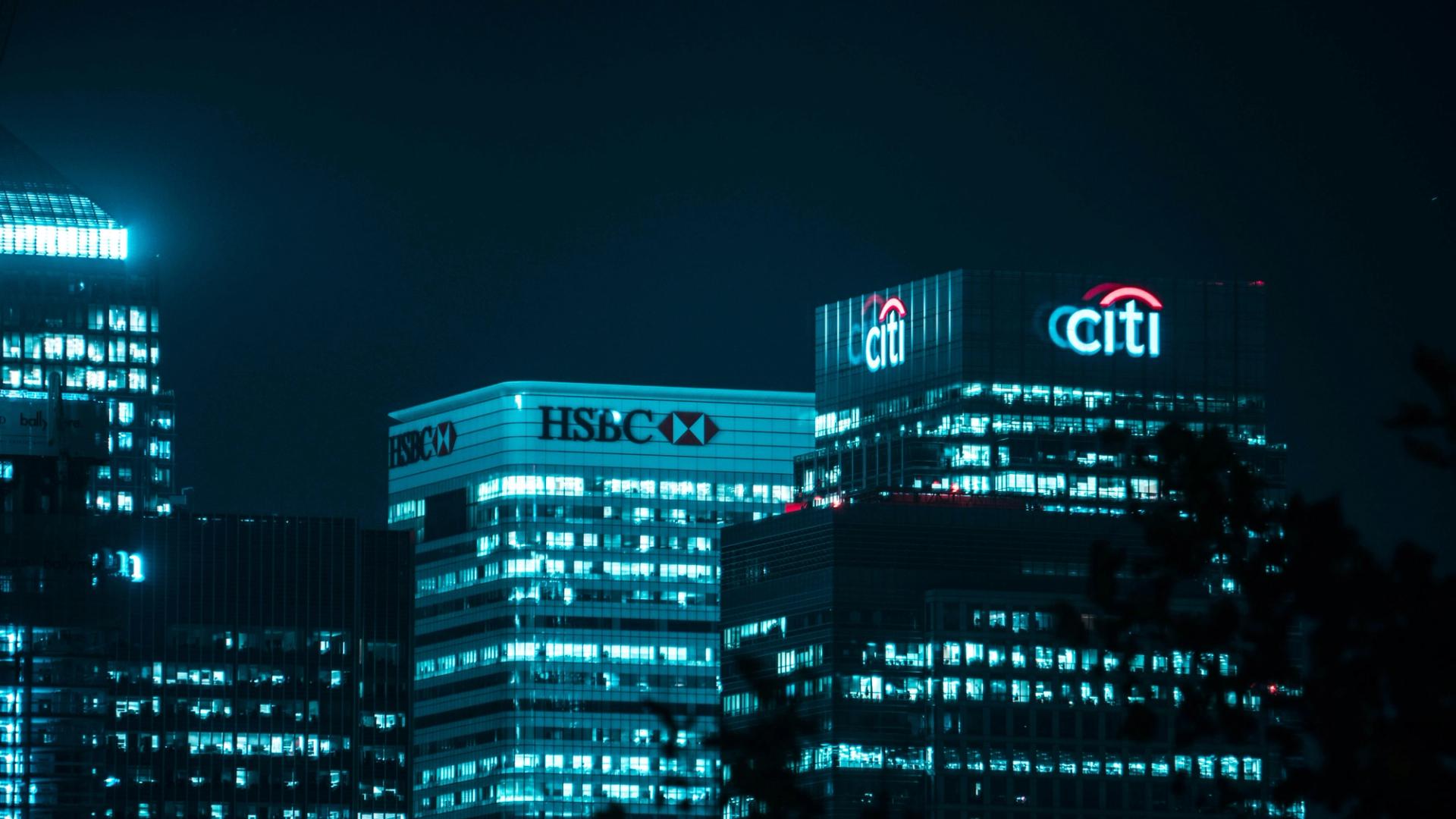 HSBC, Citi logos on top of skyscrapers.