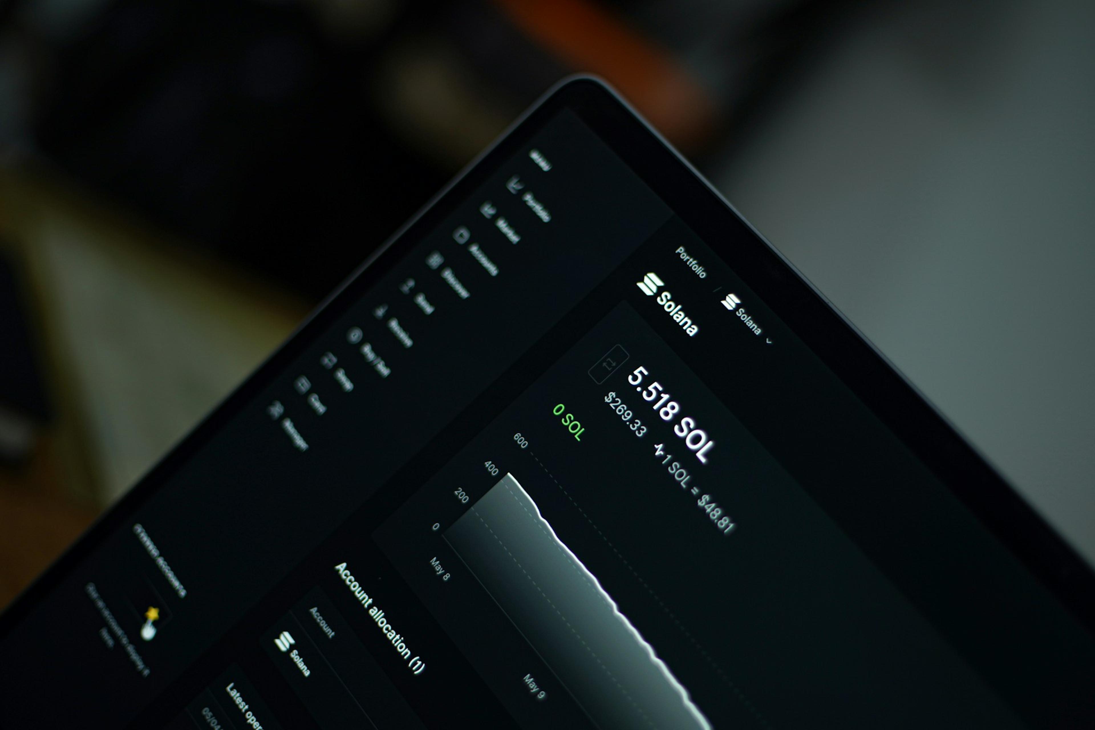 A laptop displaying a Solana portfolio