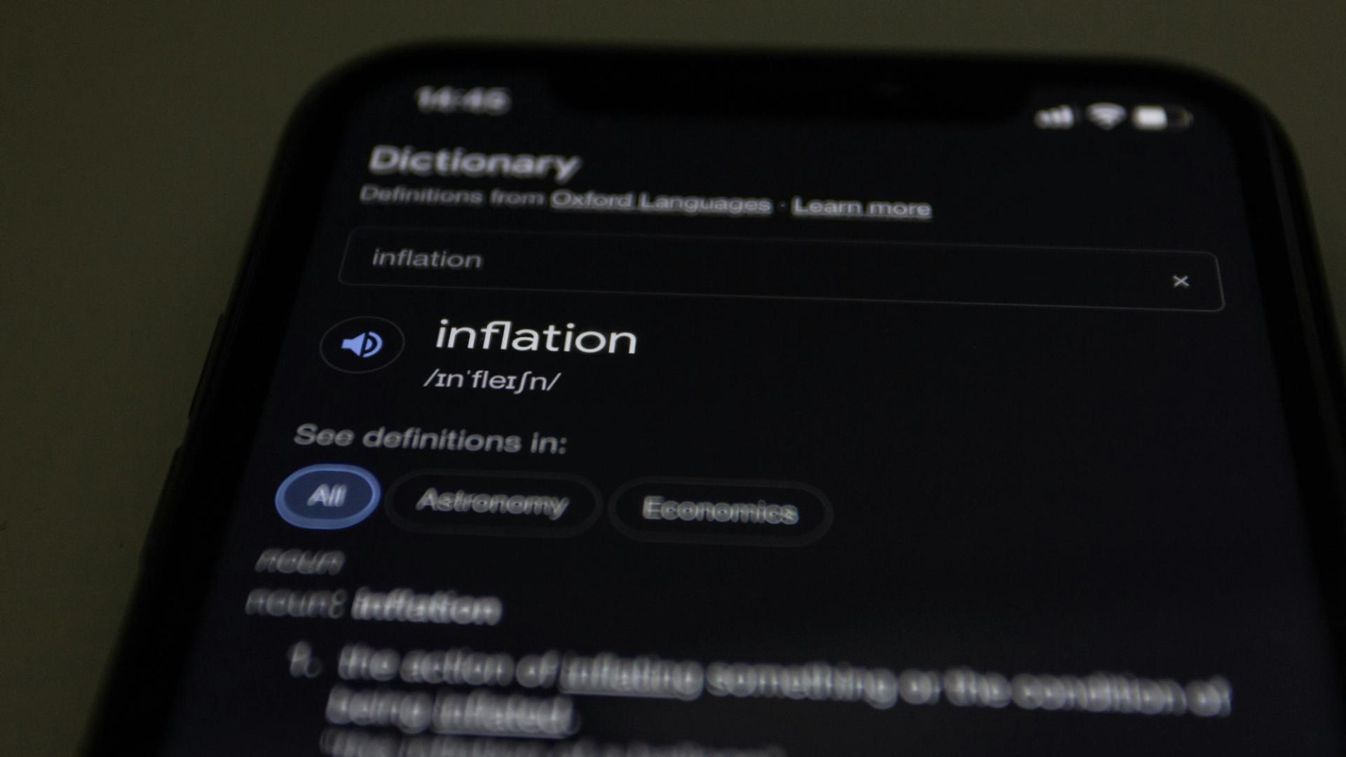 Mobile phone screen showing a definition of inflation