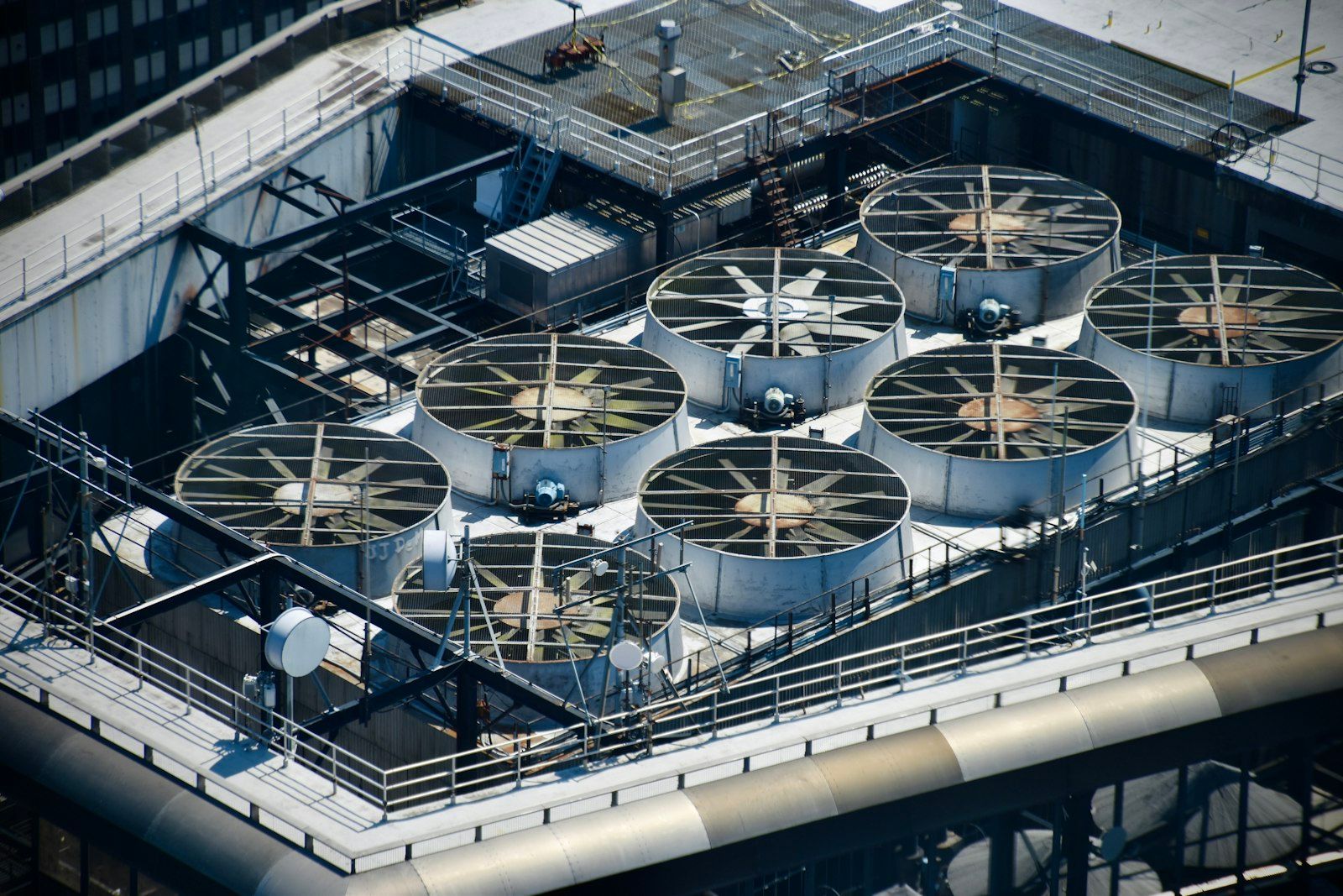 Rooftop commercial HVAC chillers on a high-rise
