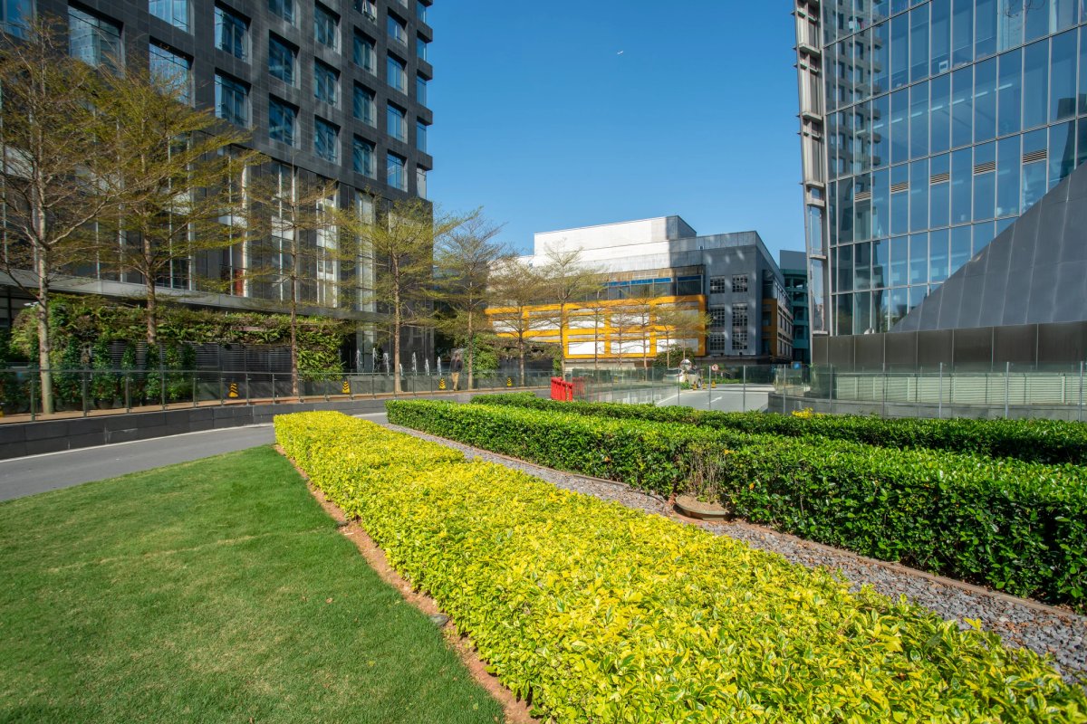 Commercial landscaping crew maintaining corporate grounds — Commercial Landscaping salary guide cover
