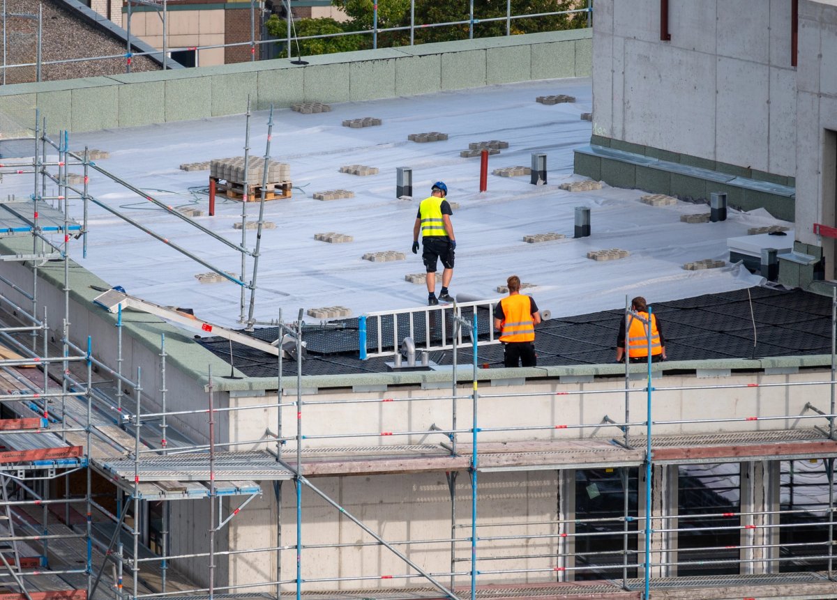 Commercial roofing crew on a flat-roof installation — Commercial Roofing interview guide cover