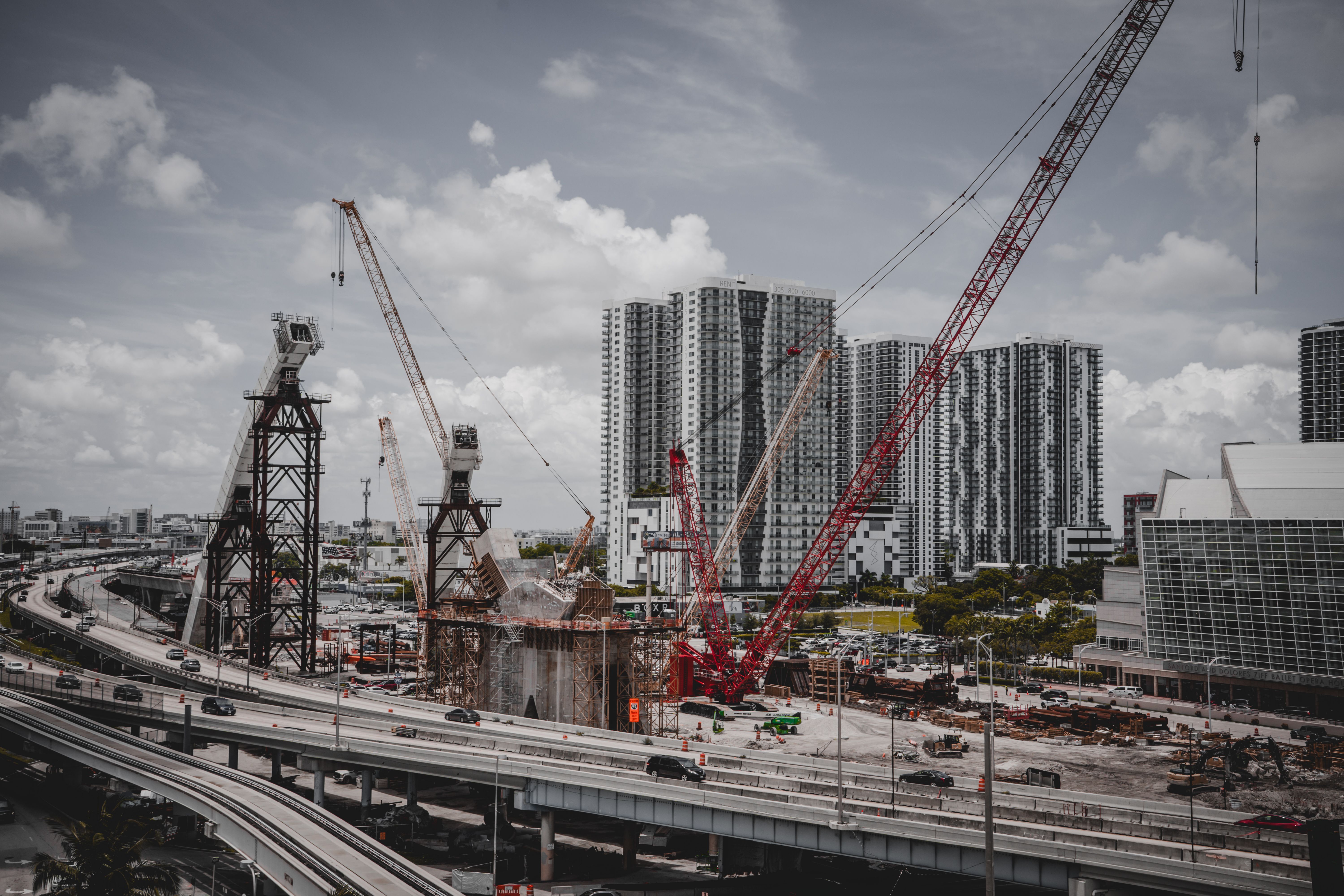 Miami cityscape with high-rise buildings and an active construction site.