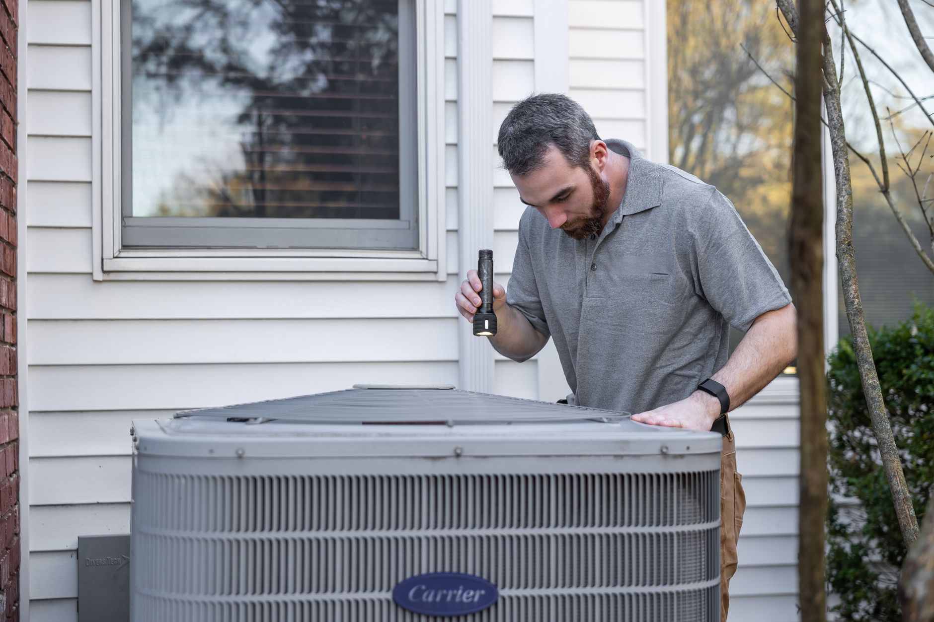 An HVAC technician servicing commercial equipment.