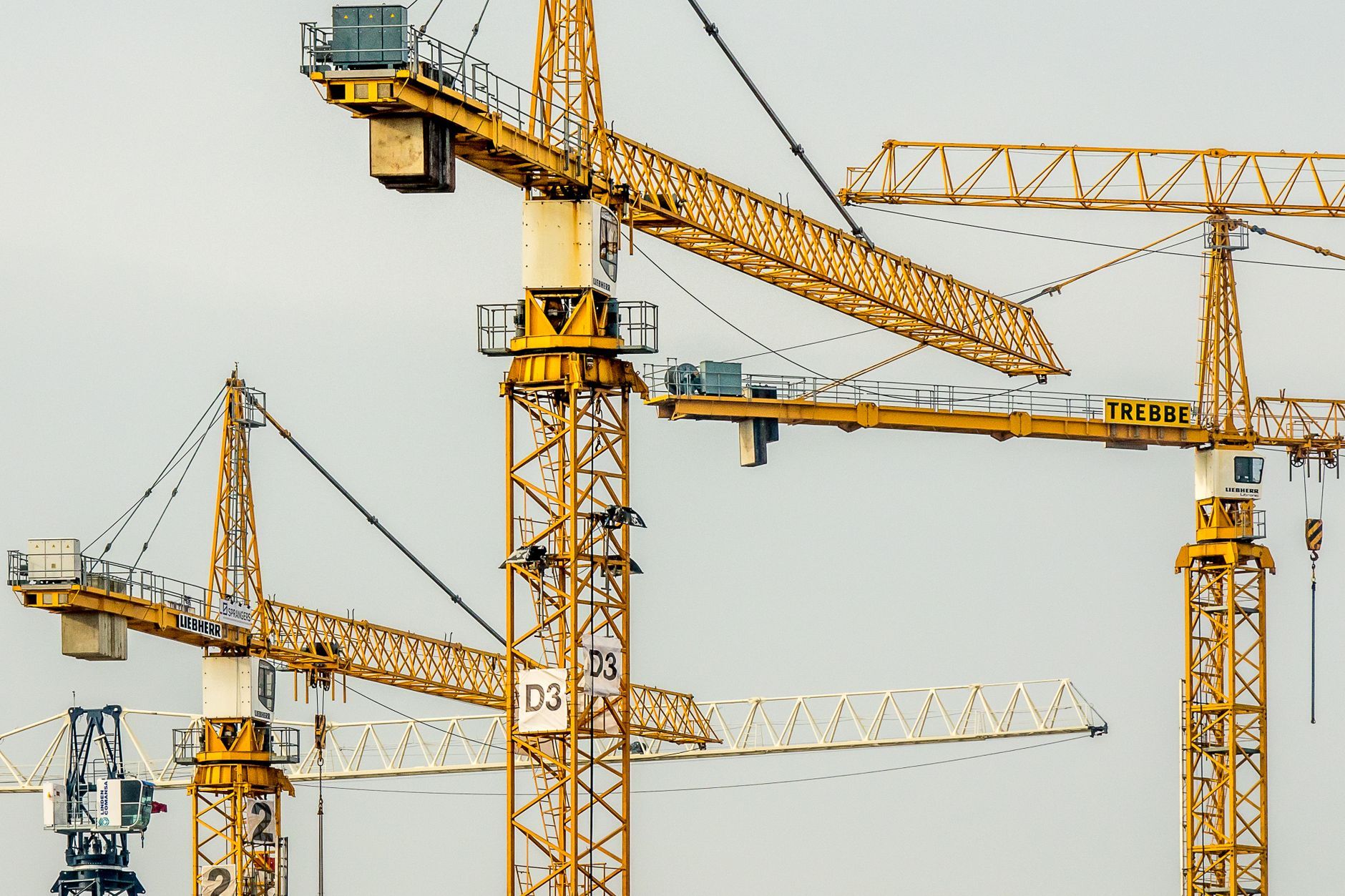 A crane over a commercial building under construction.