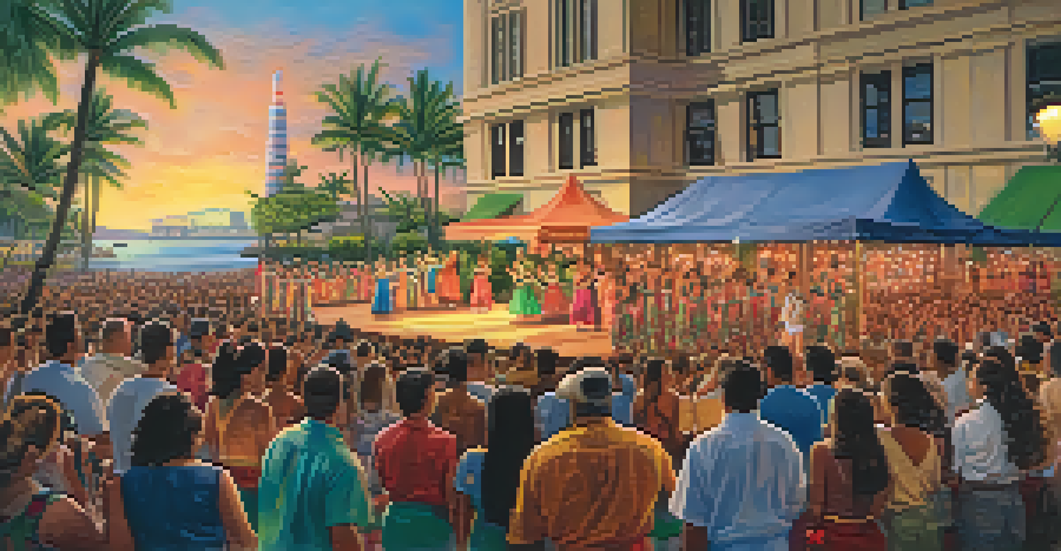 Hula dancers performing on stage at the Aloha Tower Festival with an enthusiastic audience and the Aloha Tower in the background.