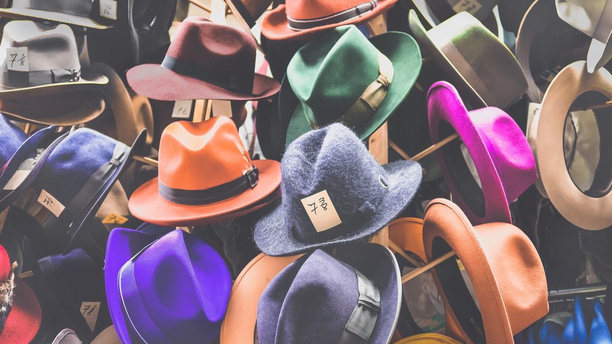 A wall of lots of different hats, from the Warner Brothers costume department.