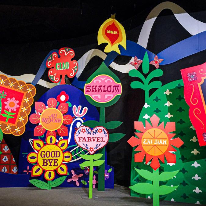 Brightly coloured flower-shaped signs containing the word 